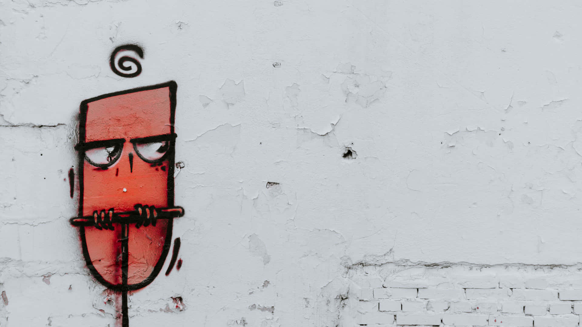 Graffiti Wall Art With A Square Face And Locked Mouth Wallpaper