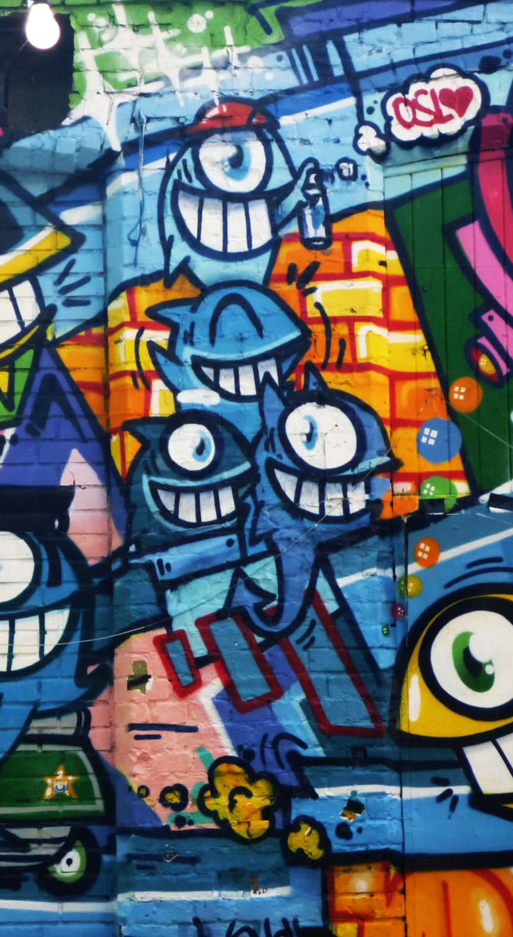 Graffiti Wall Art With One-eyed Creatures Wallpaper