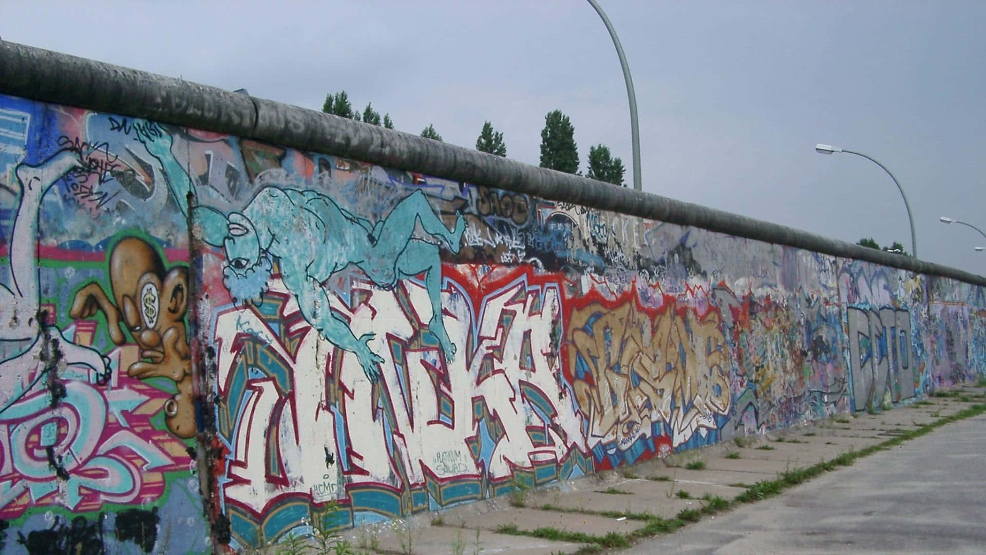 Graffiti Wall Mural On A Long Wall Background
