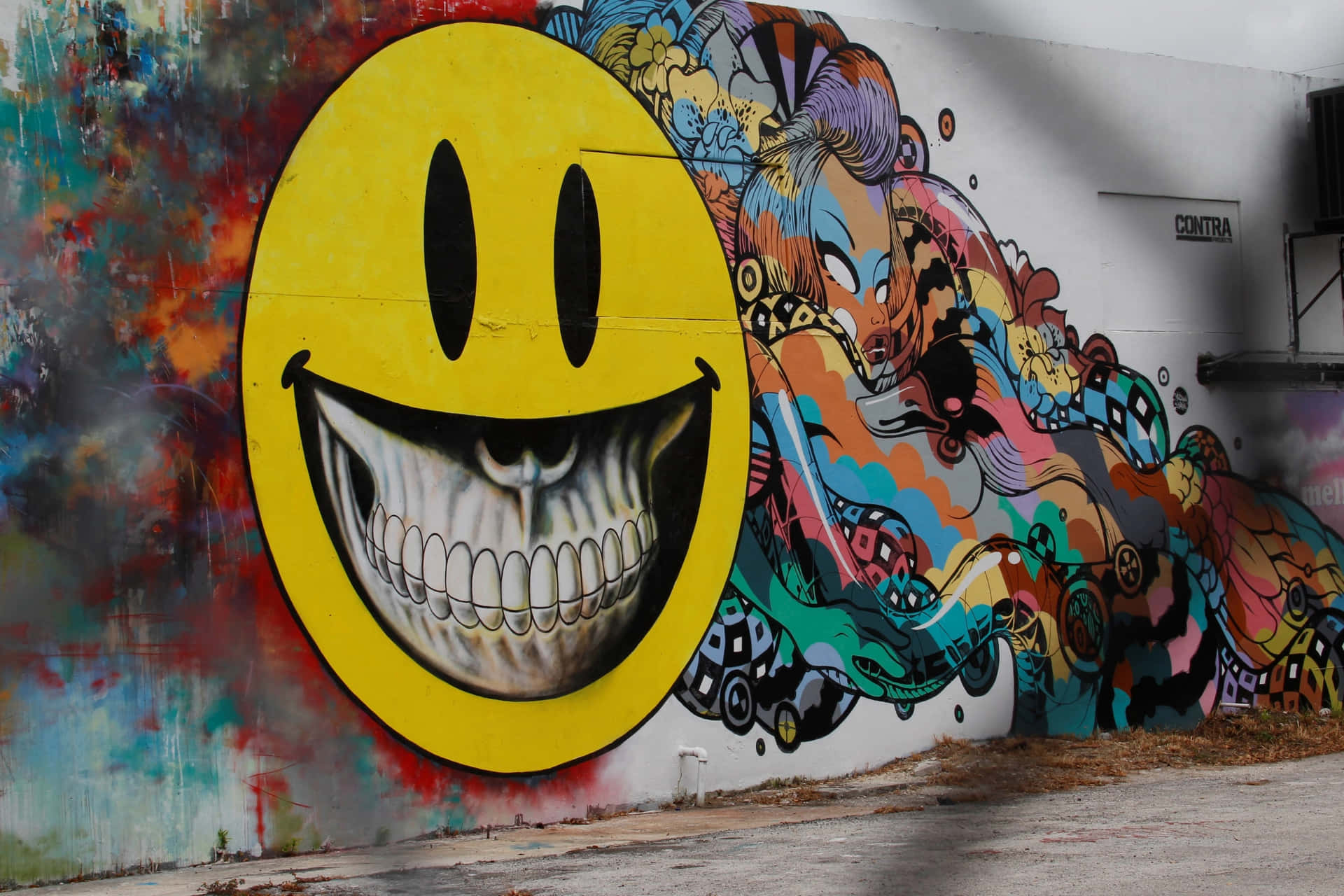 Graffiti Wall With An Emoji Head Wallpaper