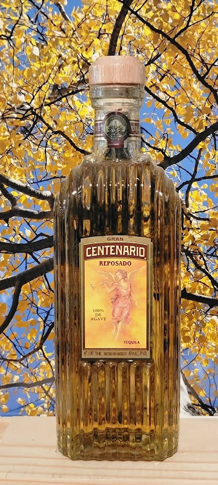 Gran Centenario Tequila Reposado Against A Tree Wallpaper