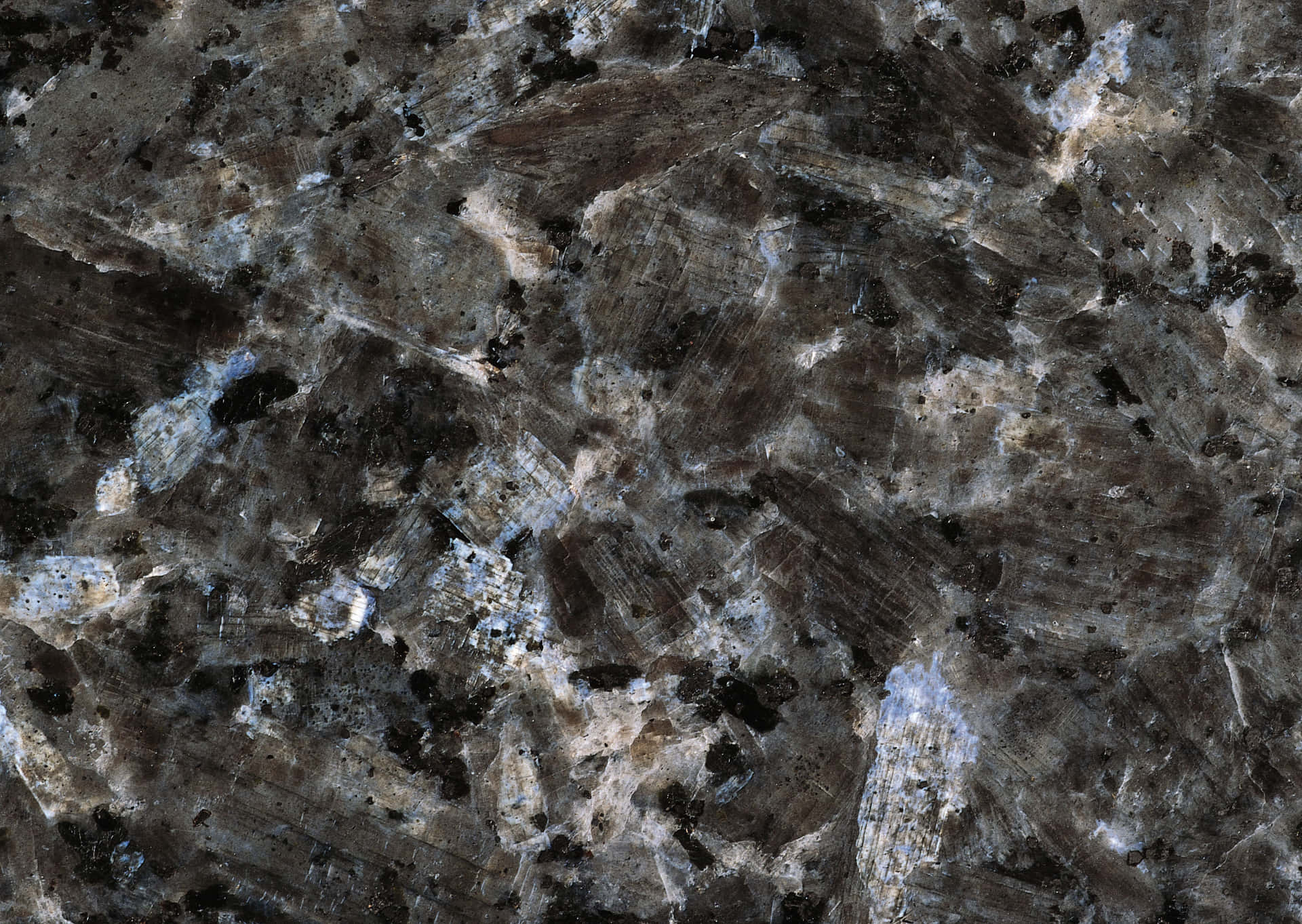 A Close Up Of A Black Granite Surface