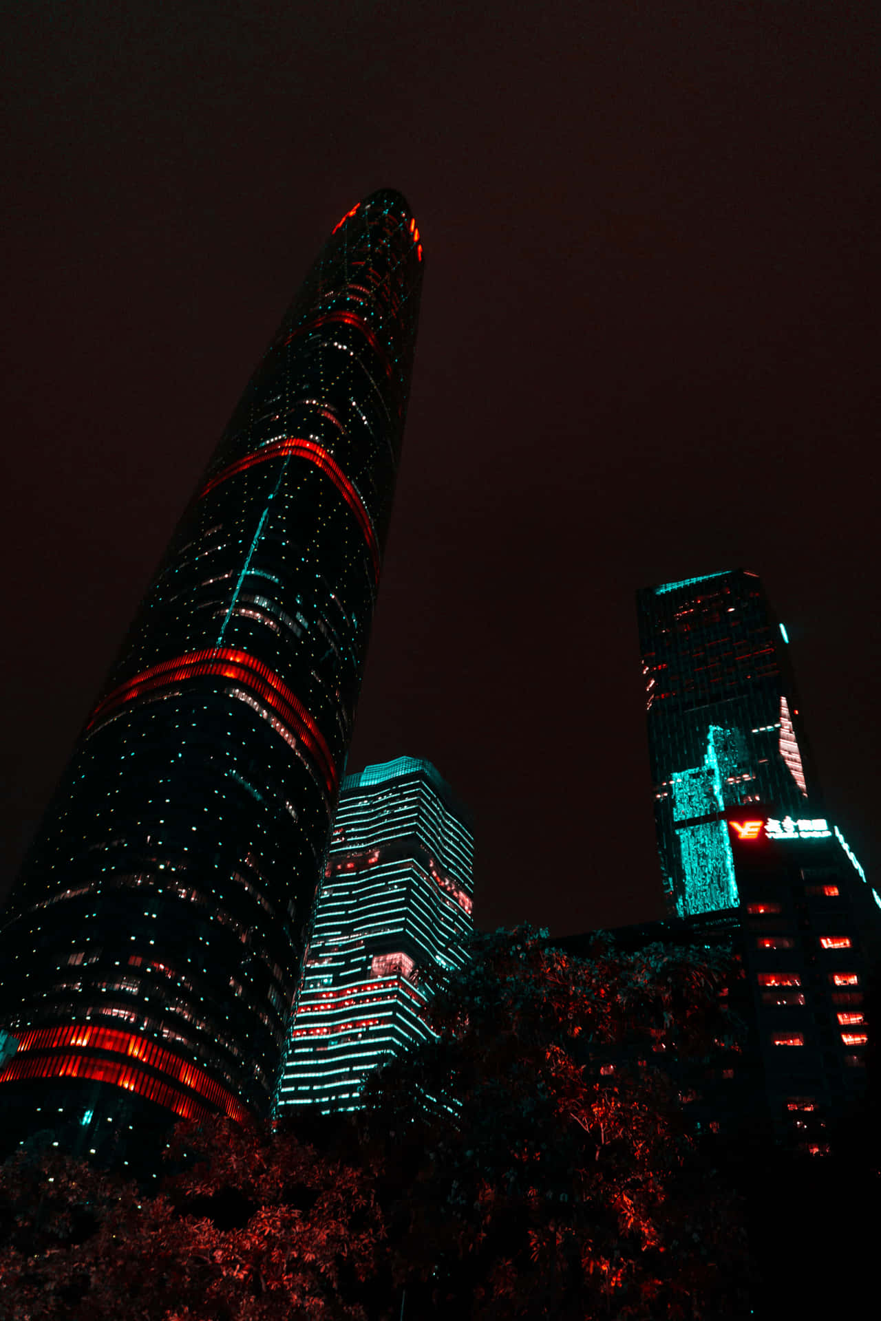 A Tall Building With Red Lights Wallpaper