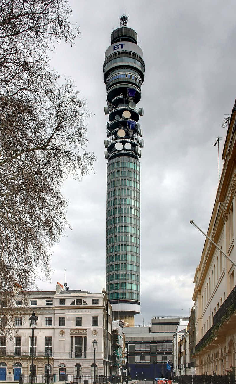 Breathtaking view of the iconic Bt Tower enveloped in a silver-grey skyline Wallpaper