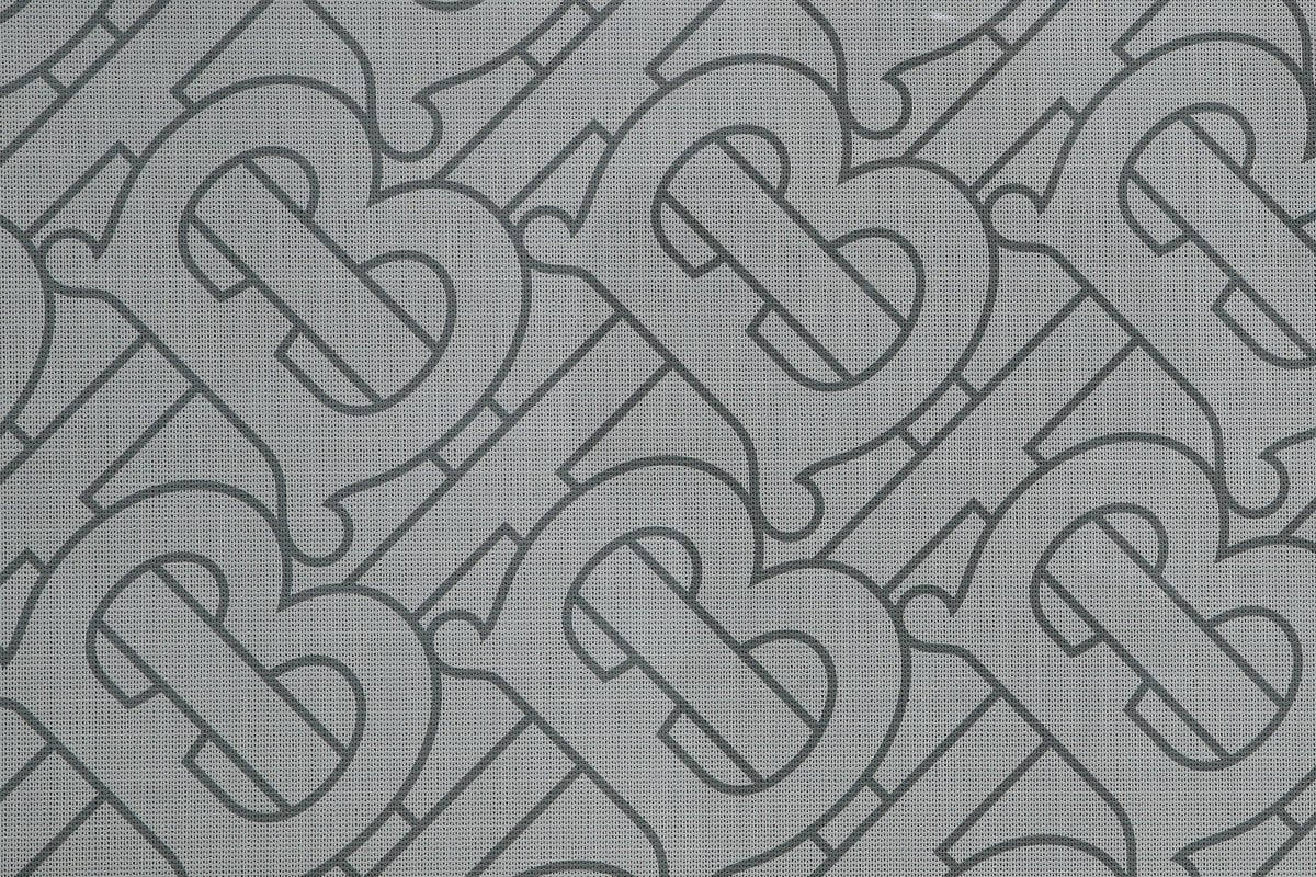 Patrónde Logotipo De Diseñador Burberry En Gris. Fondo de pantalla