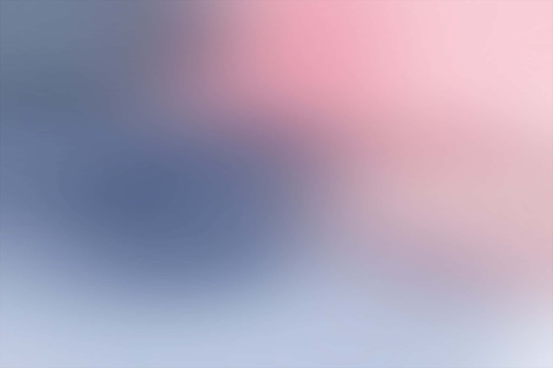 A Blurred Background With Pink And Blue Colors