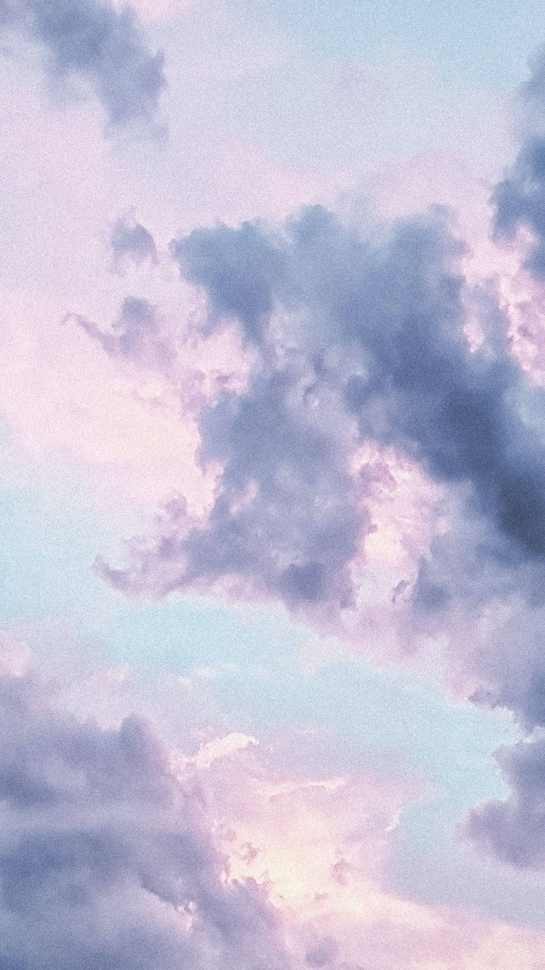 Serene Sky - A Portrait of Gray, Pink, and Blue Clouds Wallpaper