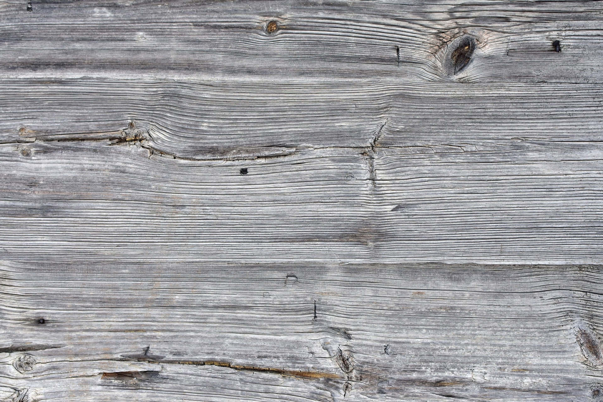 A Close Up Of A Wooden Wall With Gray Paint