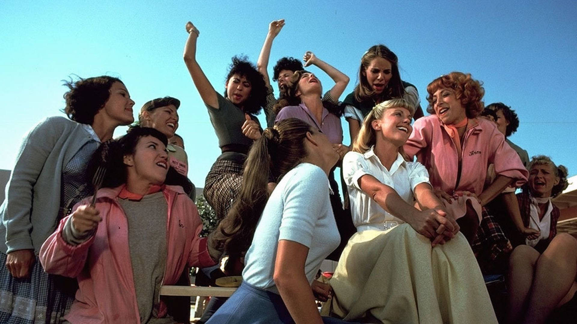 Grease Olivia As Sandy With Friends Wallpaper