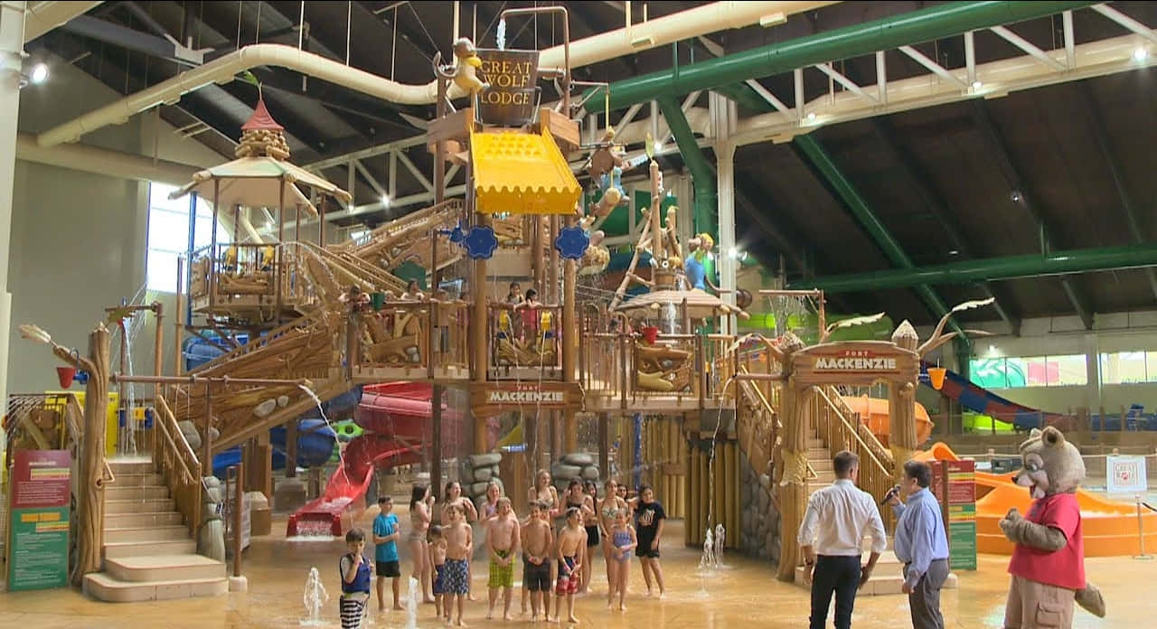 A Large Indoor Water Park With Many People