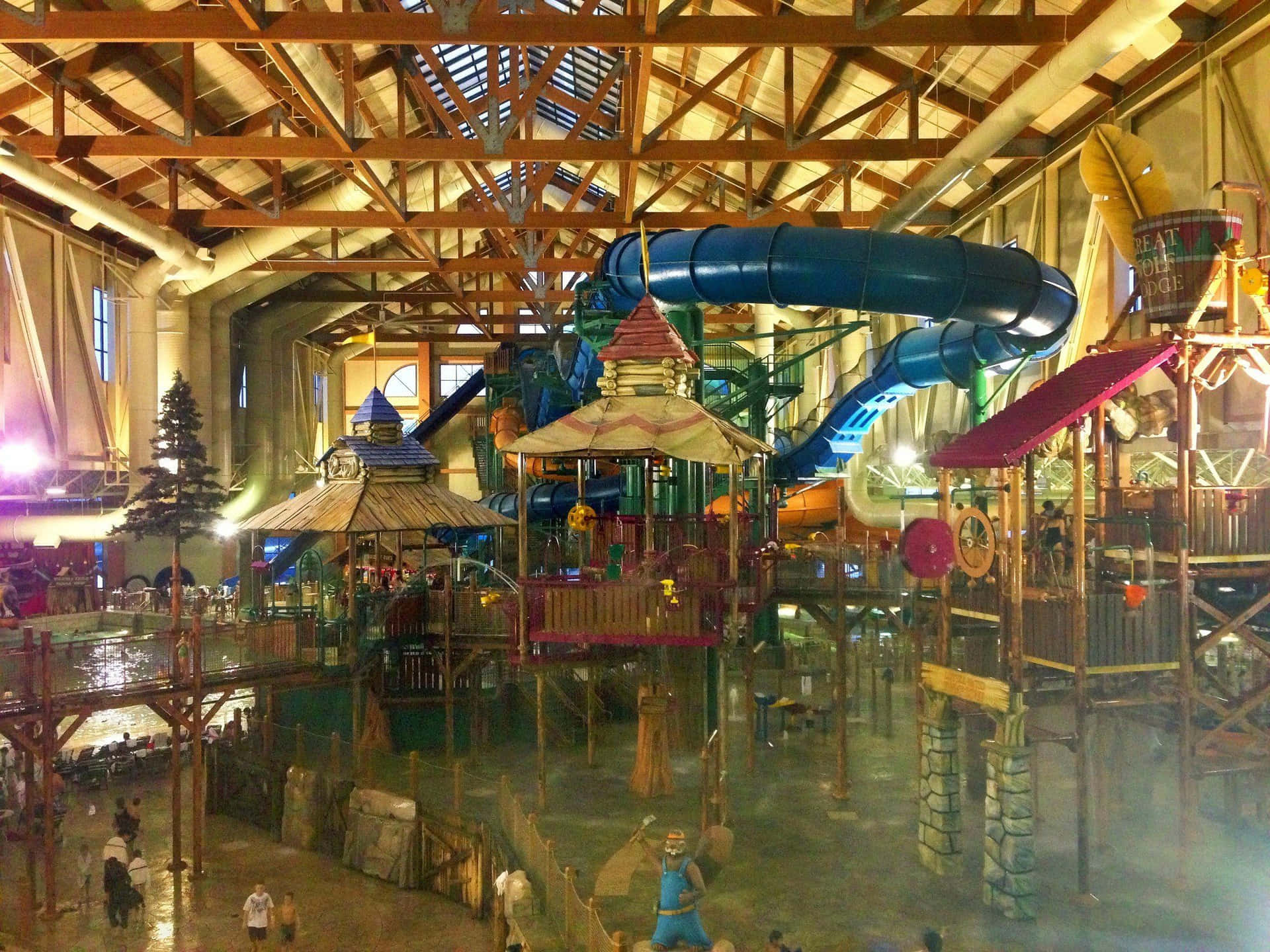 A Large Indoor Water Park With Many People