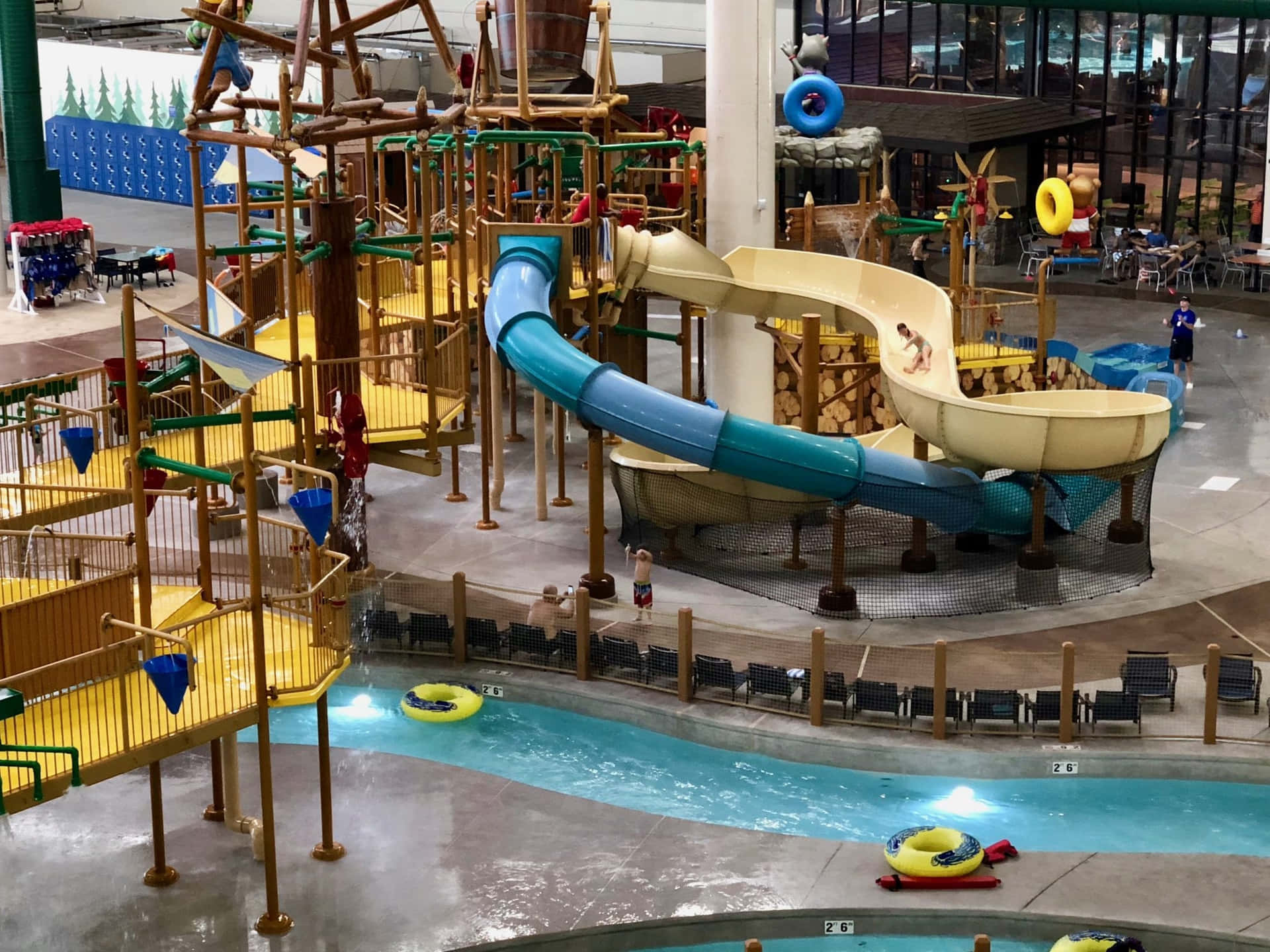 A Water Park With A Slide And Water Slides