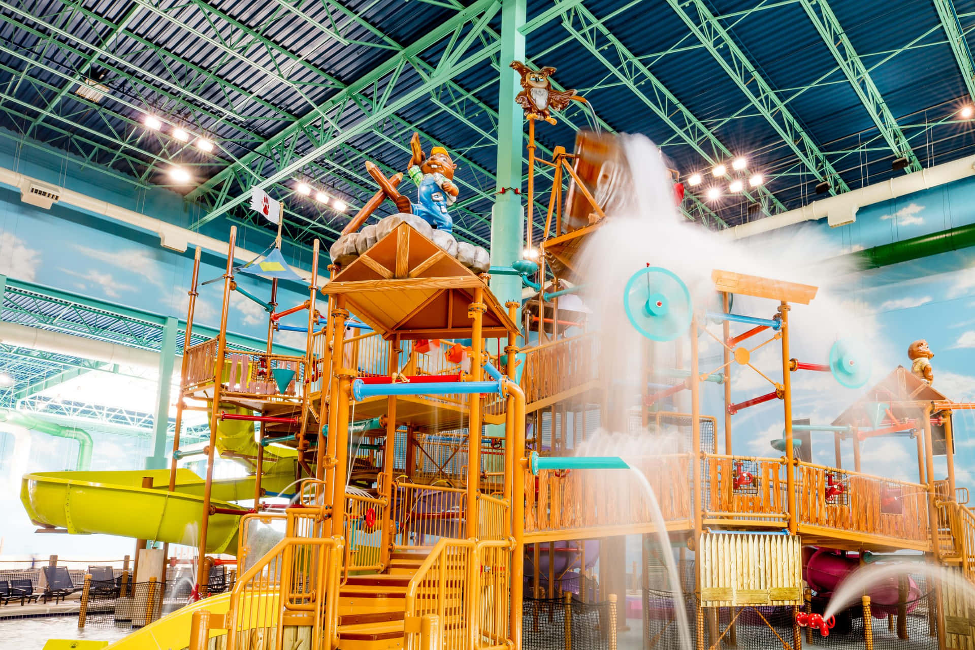 A Water Park With A Water Slide And Water Fountain