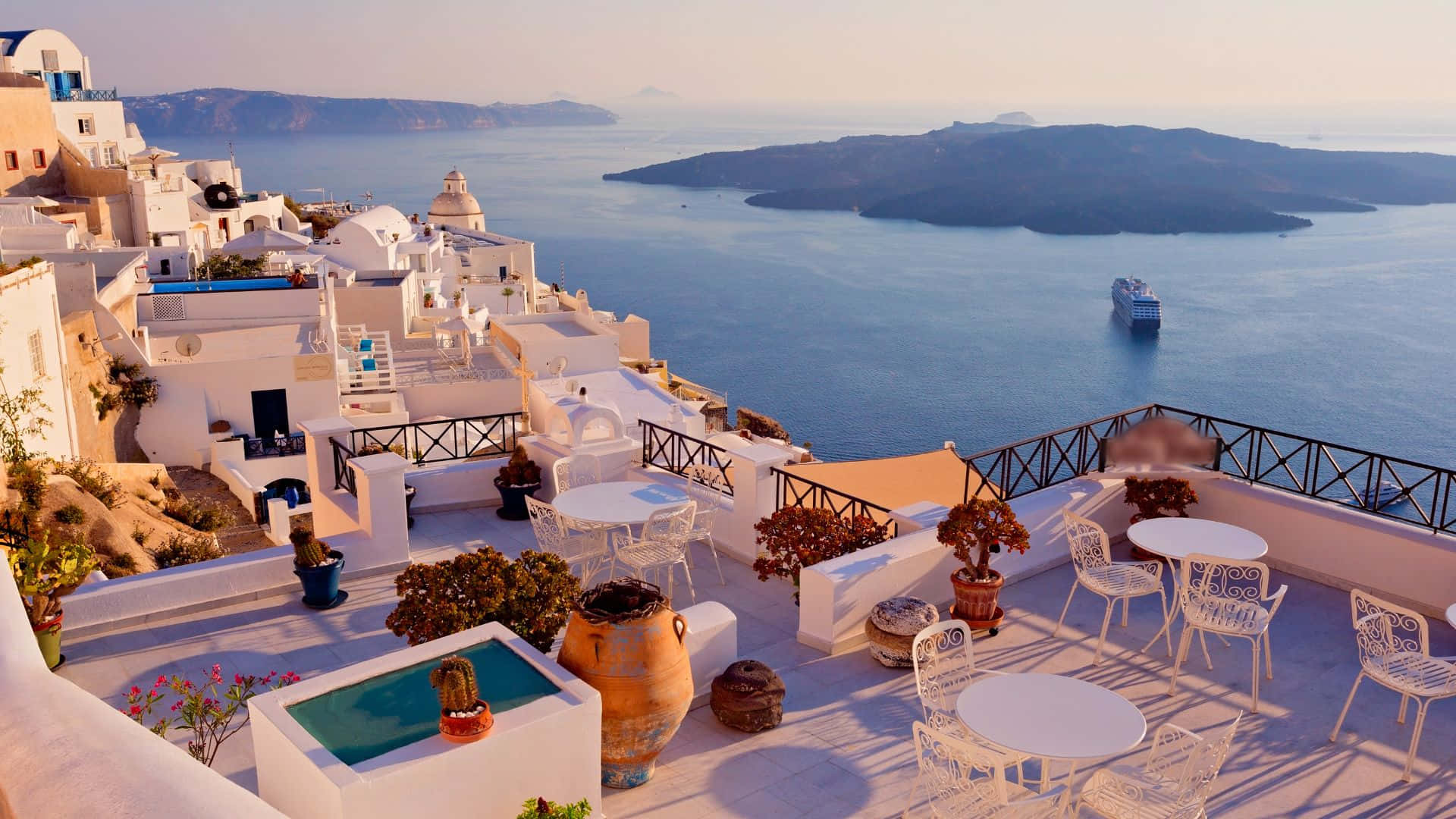 _ Enjoying the beauty of Greece's whitewashed homes and blue sea_