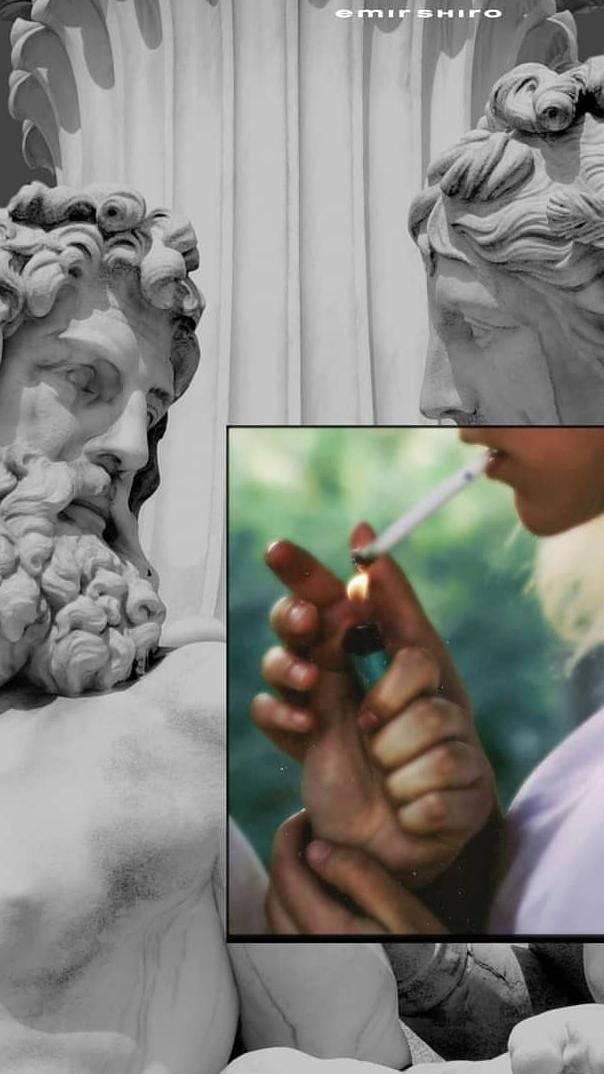 En statue af en mand der ryger en cigaret Wallpaper