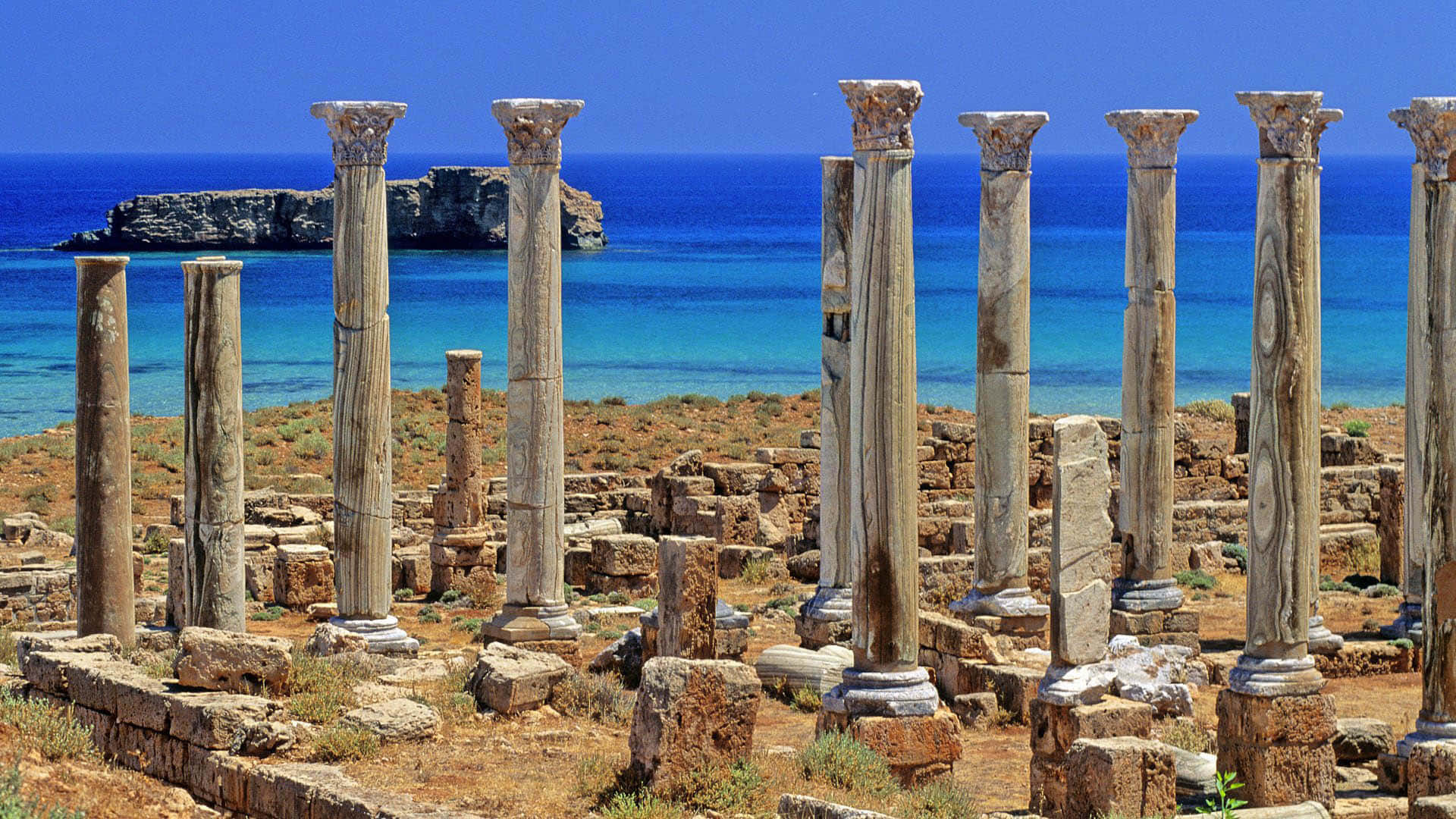 Ancient Greek architecture overlooking the Aegean sea