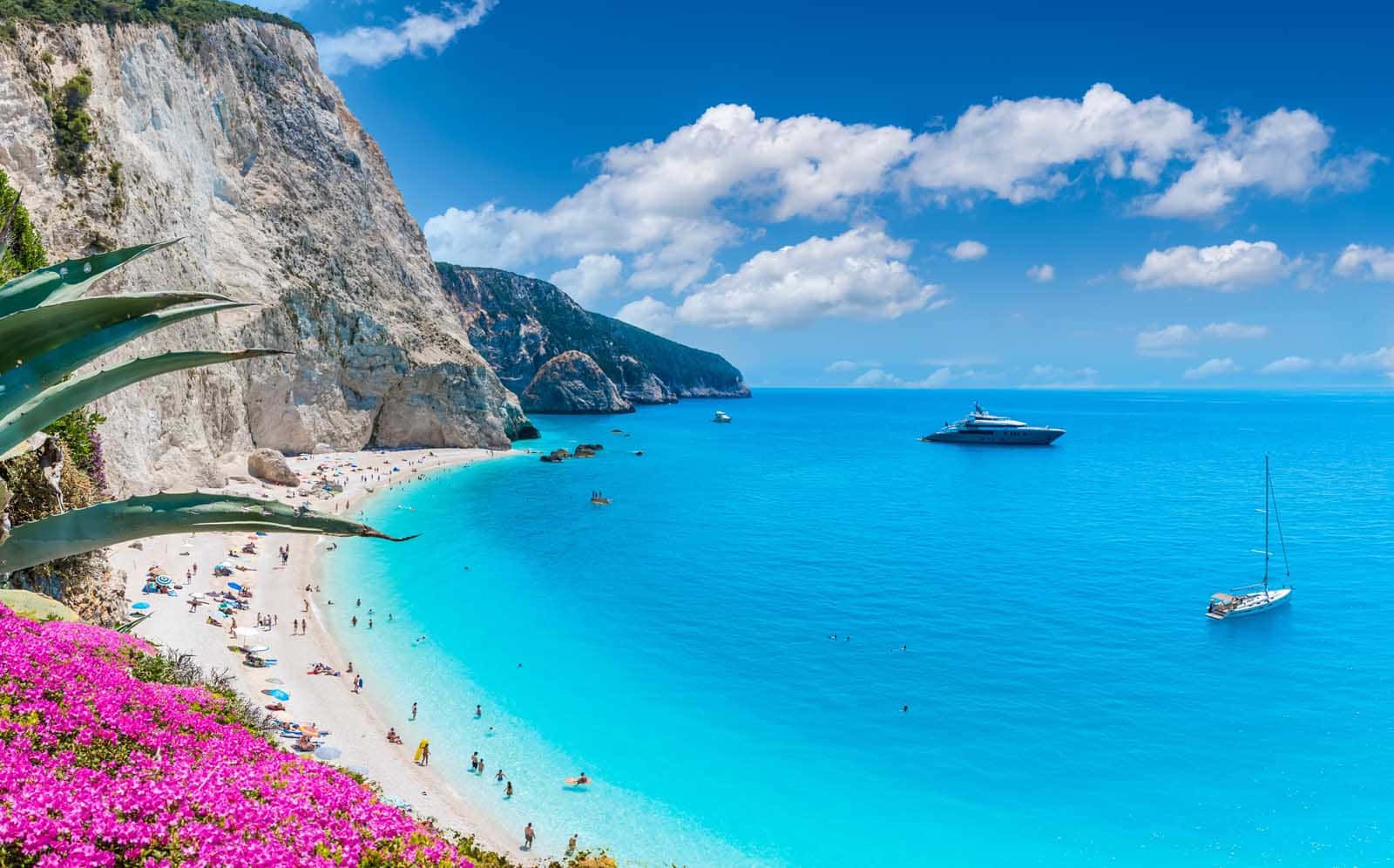 Stunning view of a serene Greek beach Wallpaper