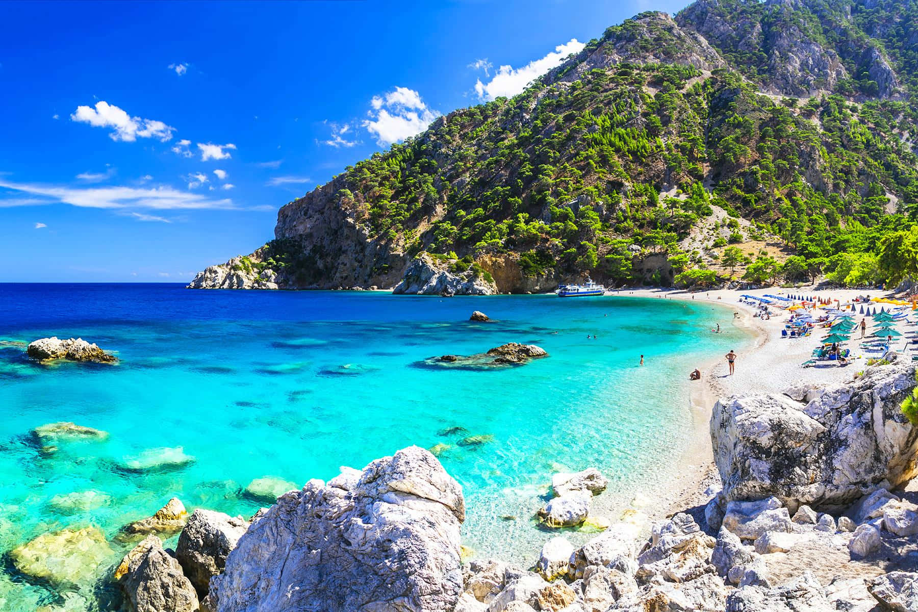 Sun-soaked shores of pristine Greek Beach Wallpaper