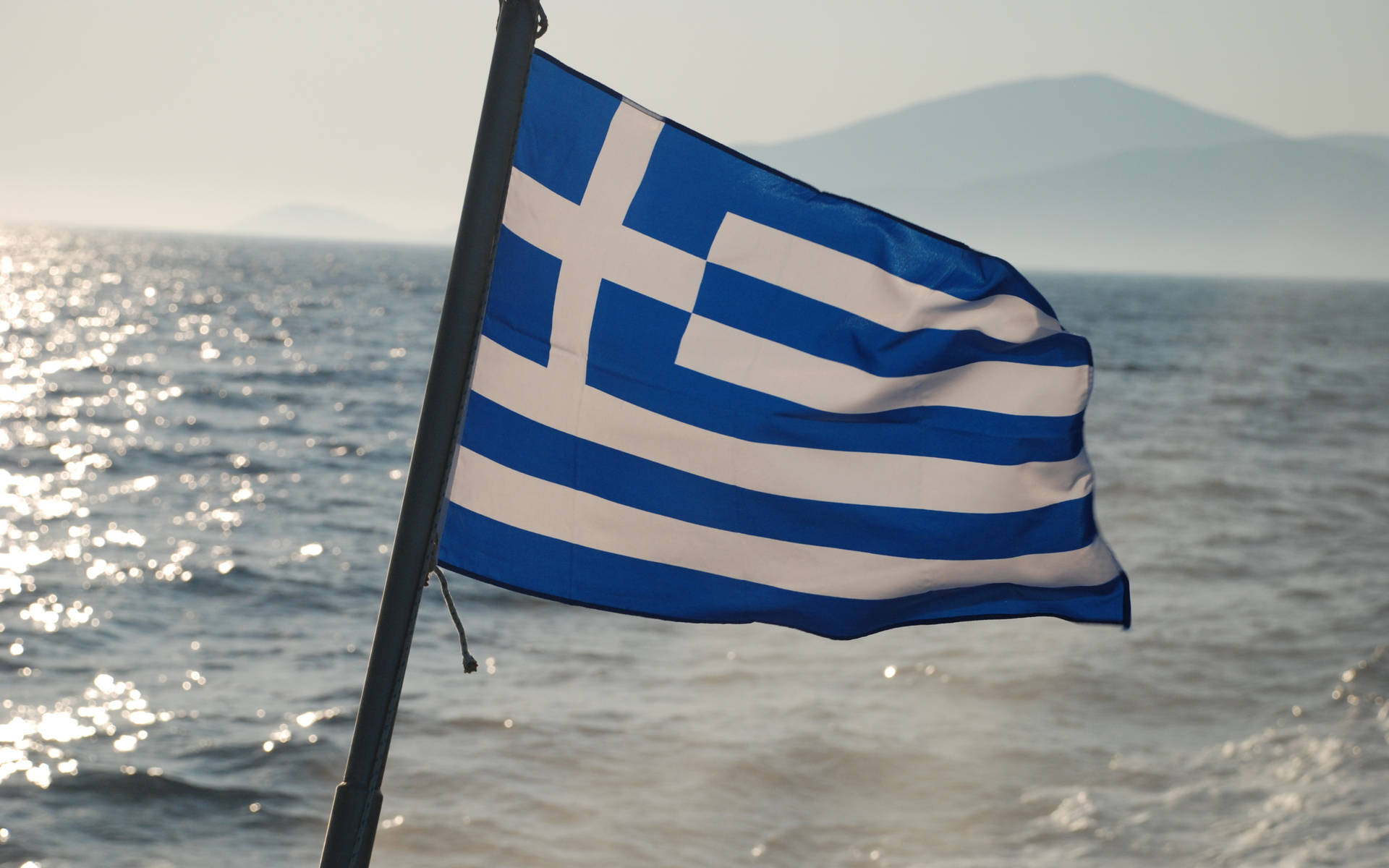 Græsk Flag På Stranden Wallpaper