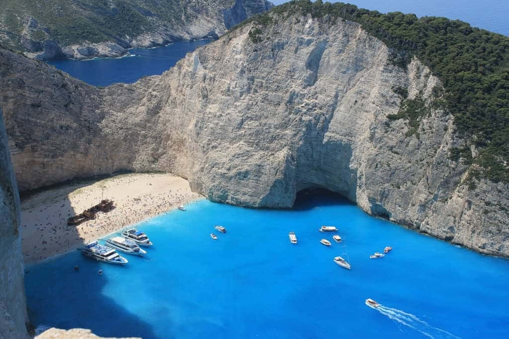 Idyllic Greek Island with Clear Blue Sea Wallpaper