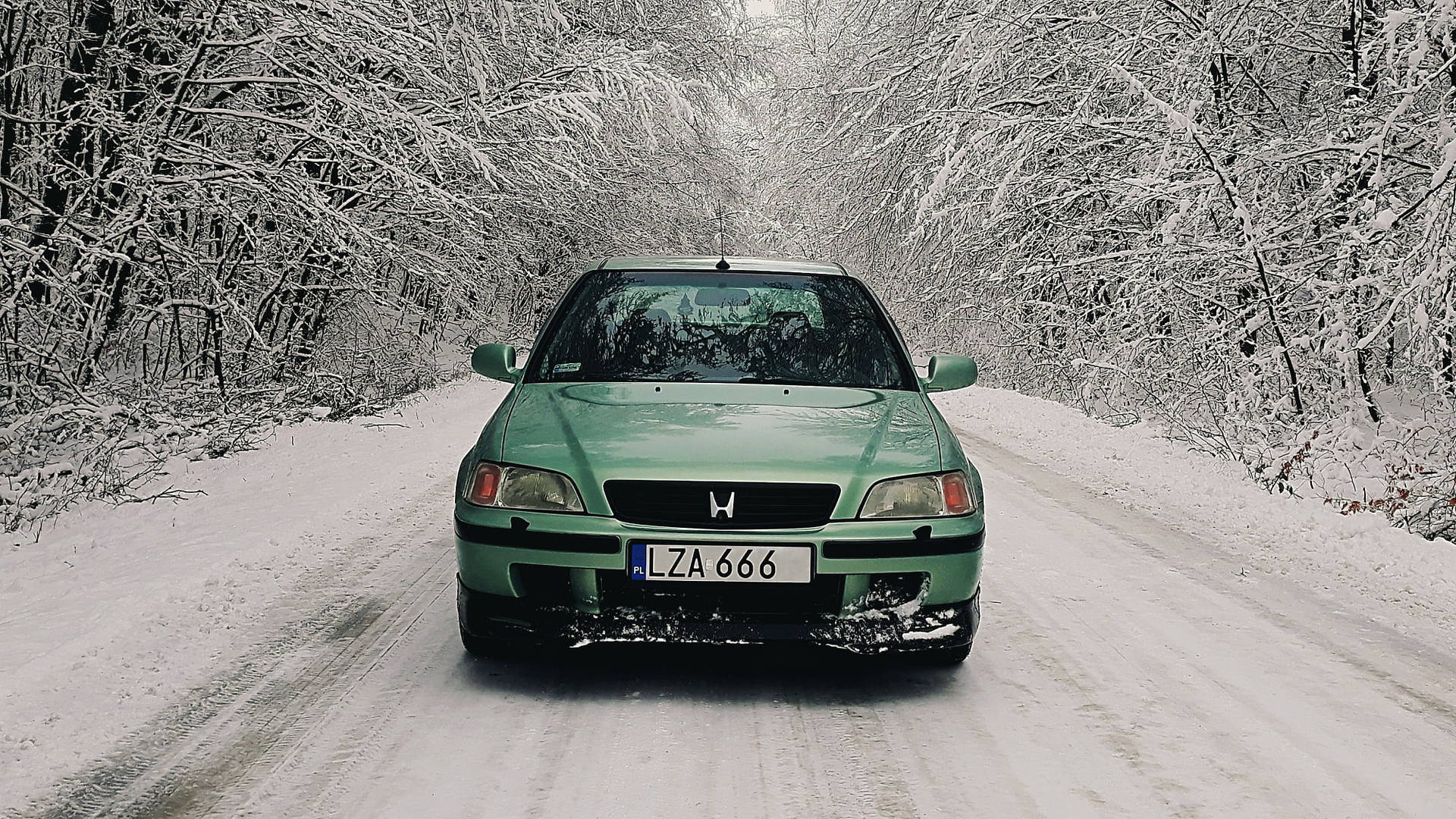 Green 4K Honda Civic In Snow Wallpaper