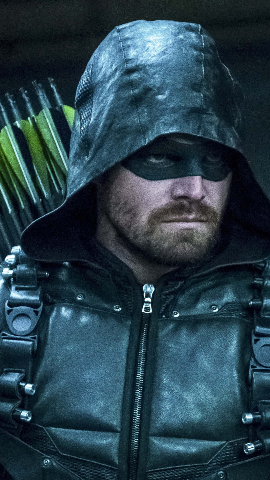 Green Arrow In A Black Outfit With Arrows Wallpaper