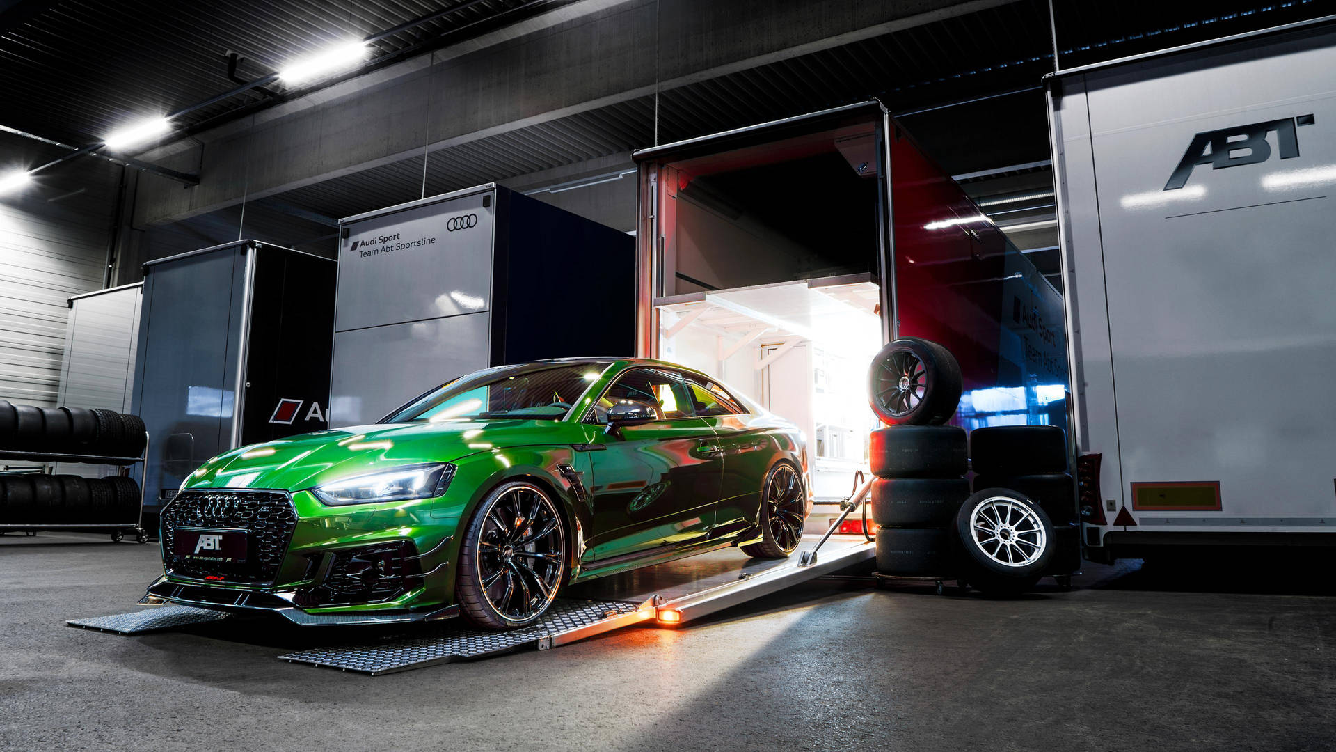 Green Audi RS Exiting A Truck Wallpaper