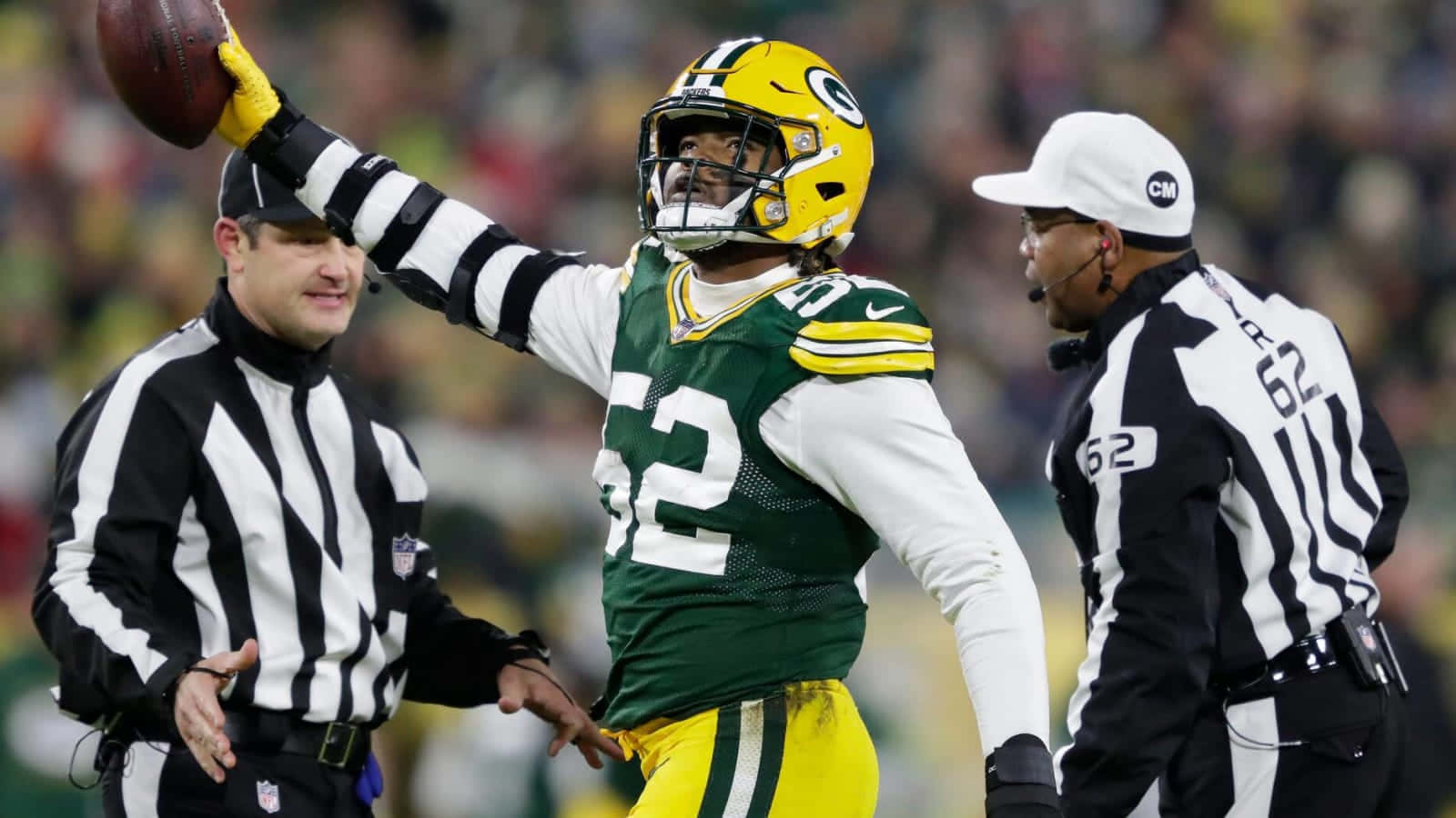 Green Bay Packers Player Celebratingwith Referees Wallpaper