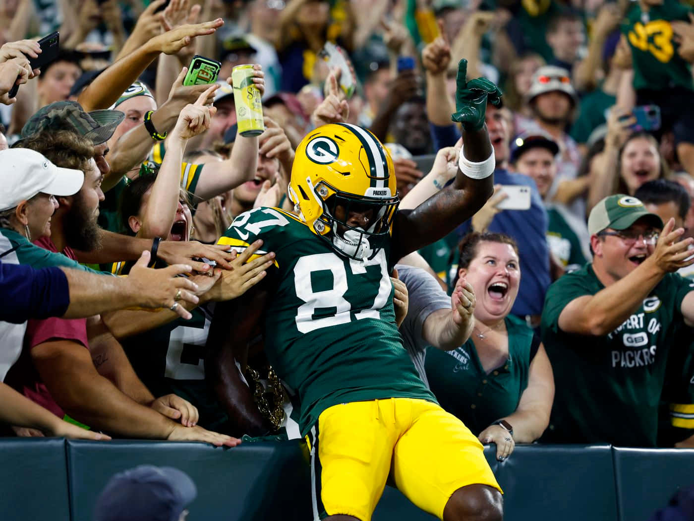 Green Bay Packers Player Celebration With Fans Wallpaper