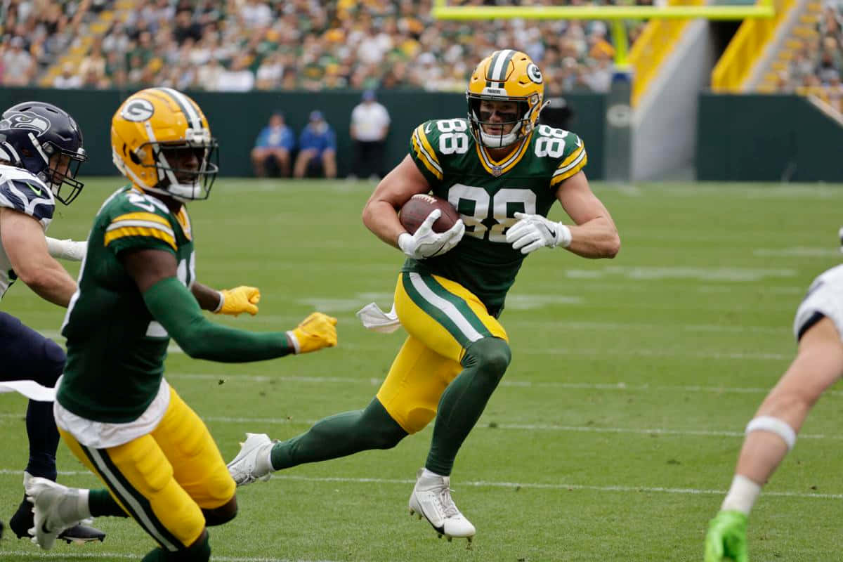 Green Bay Packers Player Running With Football Wallpaper
