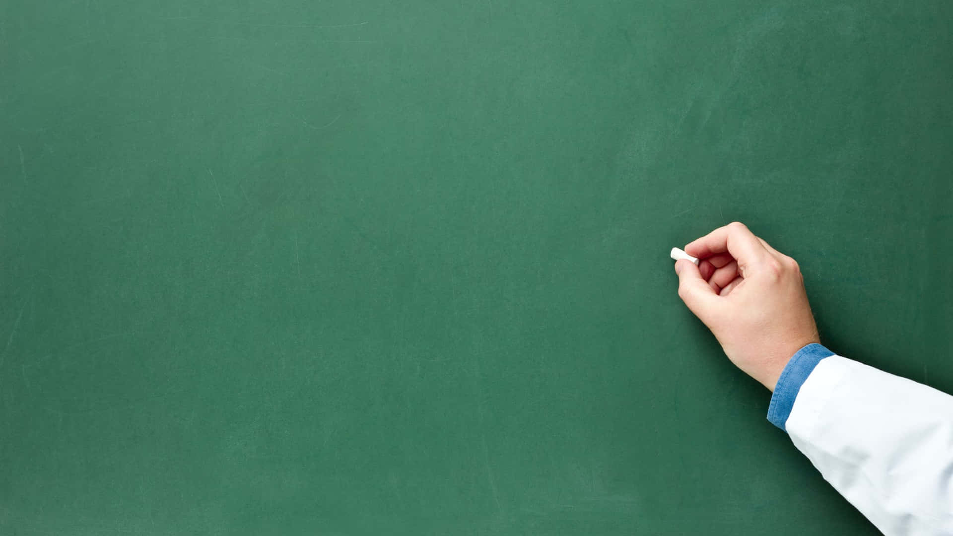 A Doctor's Hand Writing On A Blackboard