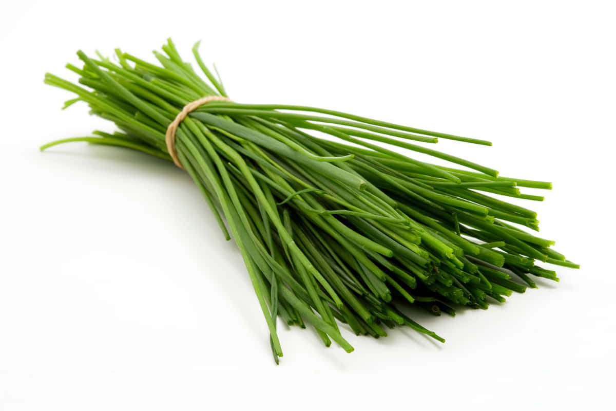 Green Chives Wrapped With Yellow Rubber Band Wallpaper