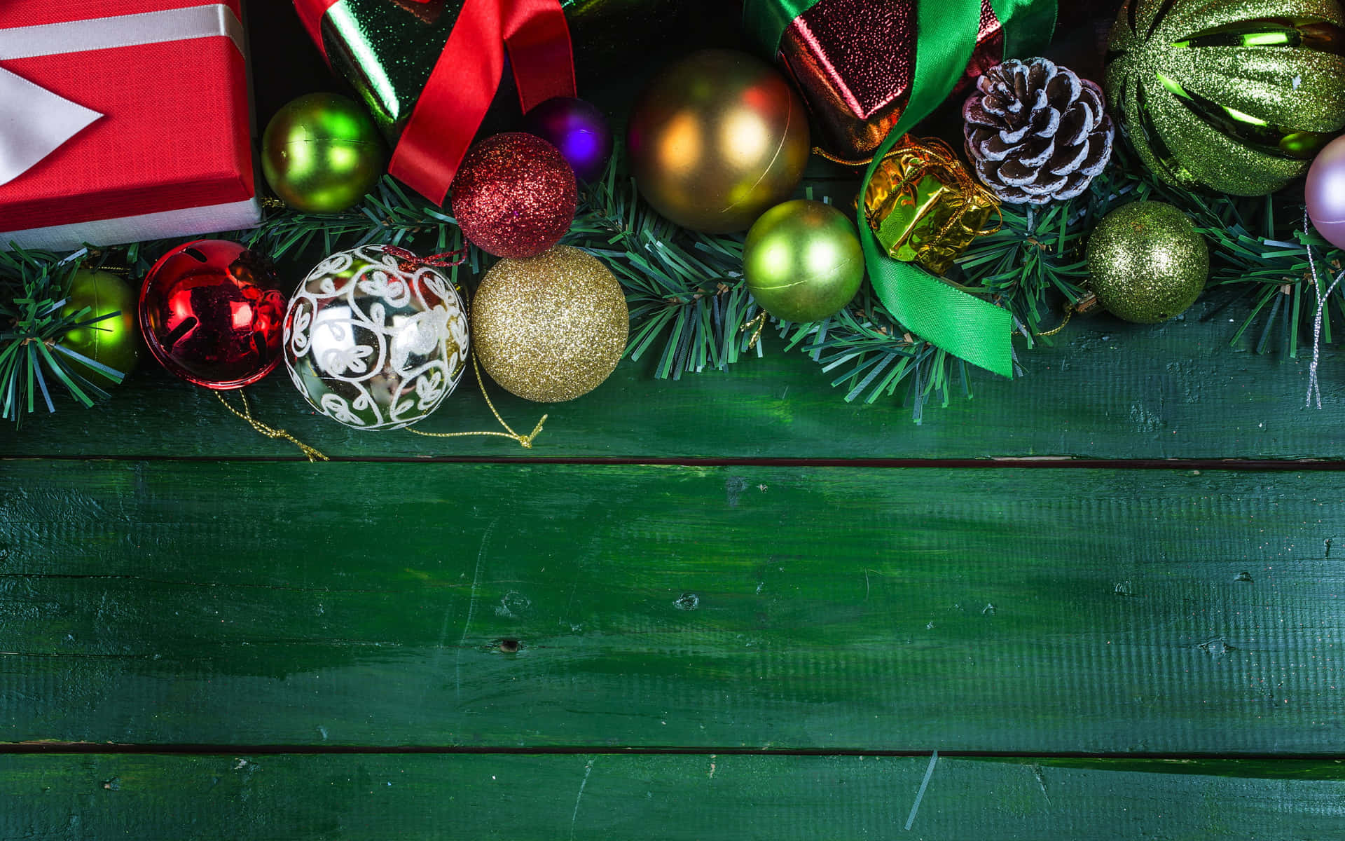 A Green Wooden Background With Christmas Decorations