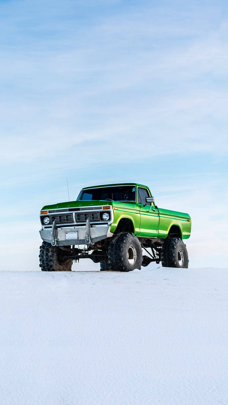 Green Cool Truck In Snow Wallpaper
