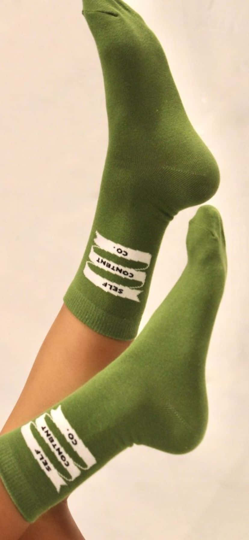 Green Crew Socks Crossed Feet Wallpaper