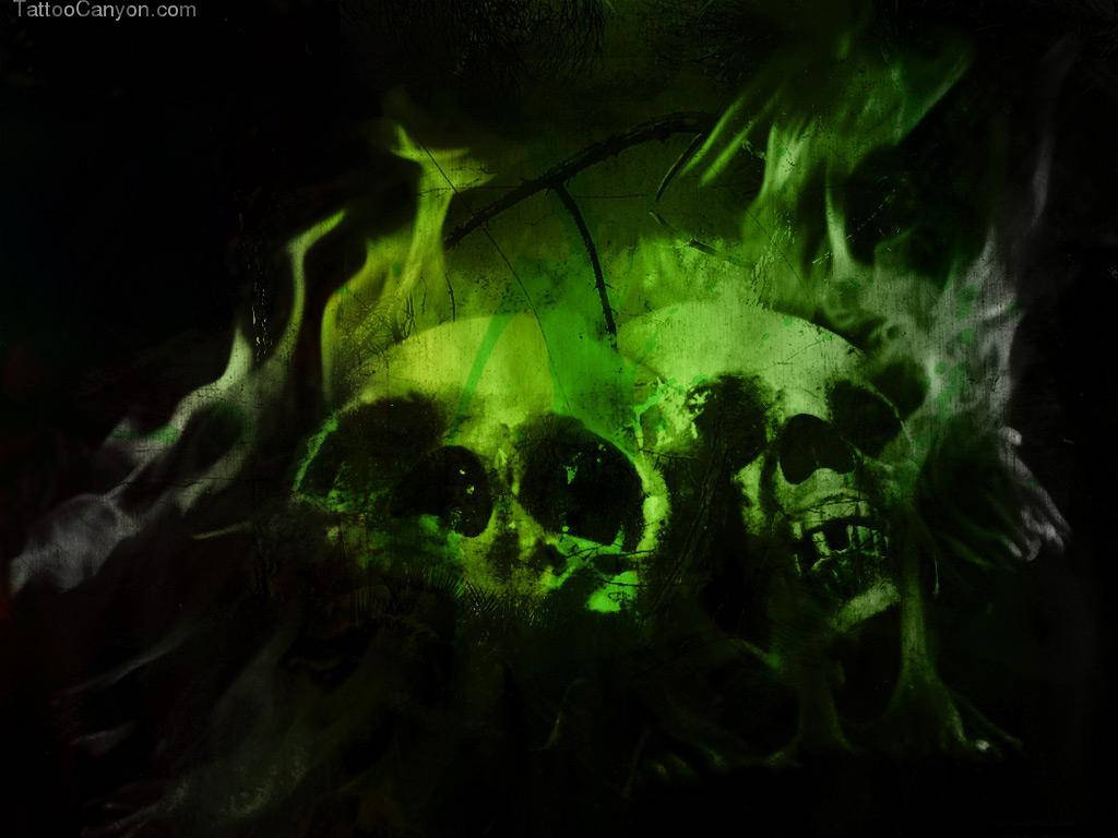 A green skull surrounded by flames. Wallpaper
