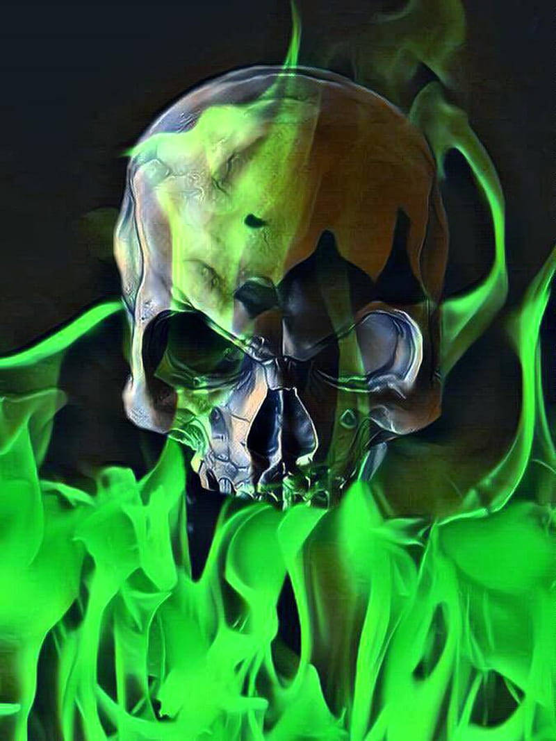 A vibrant skull engulfed in flames, with a brilliant green aura enthralling the black and orange colors. Wallpaper