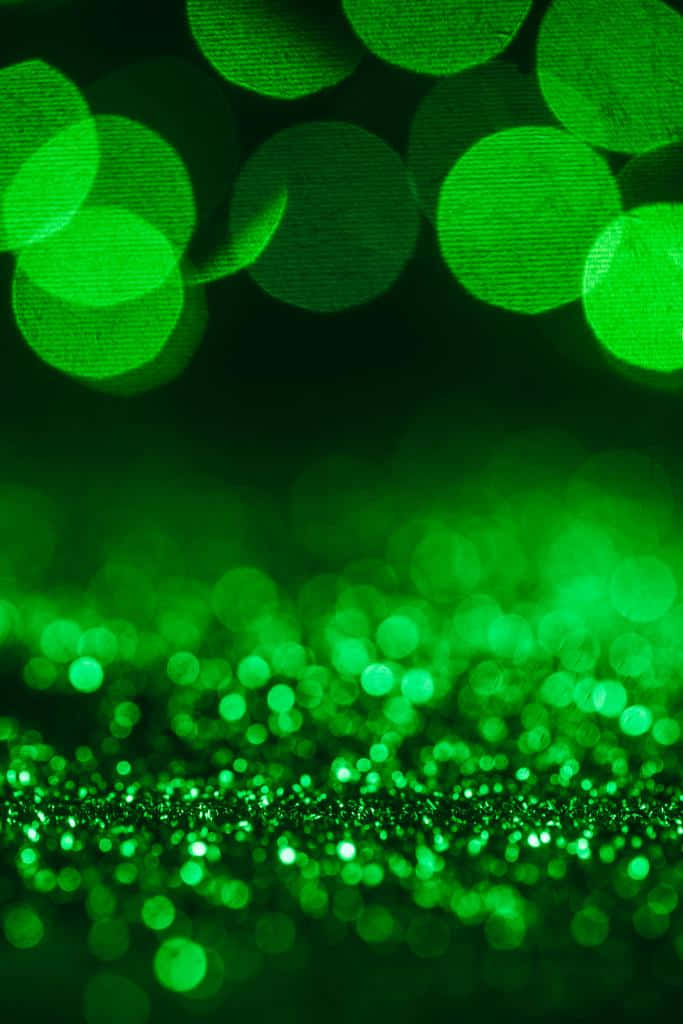 Smaragdgrøn glitters baggrund med bokeh-effekter