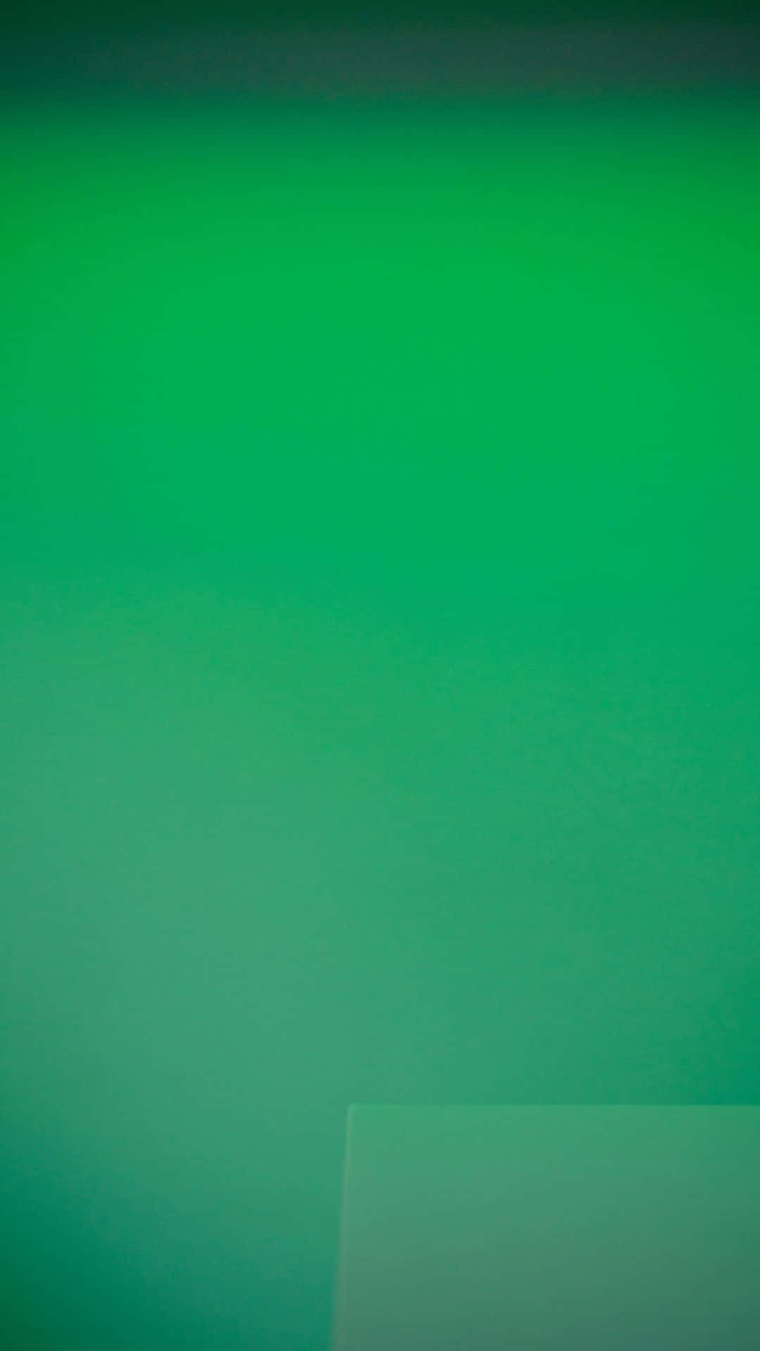 A rich and vibrant green gradient.