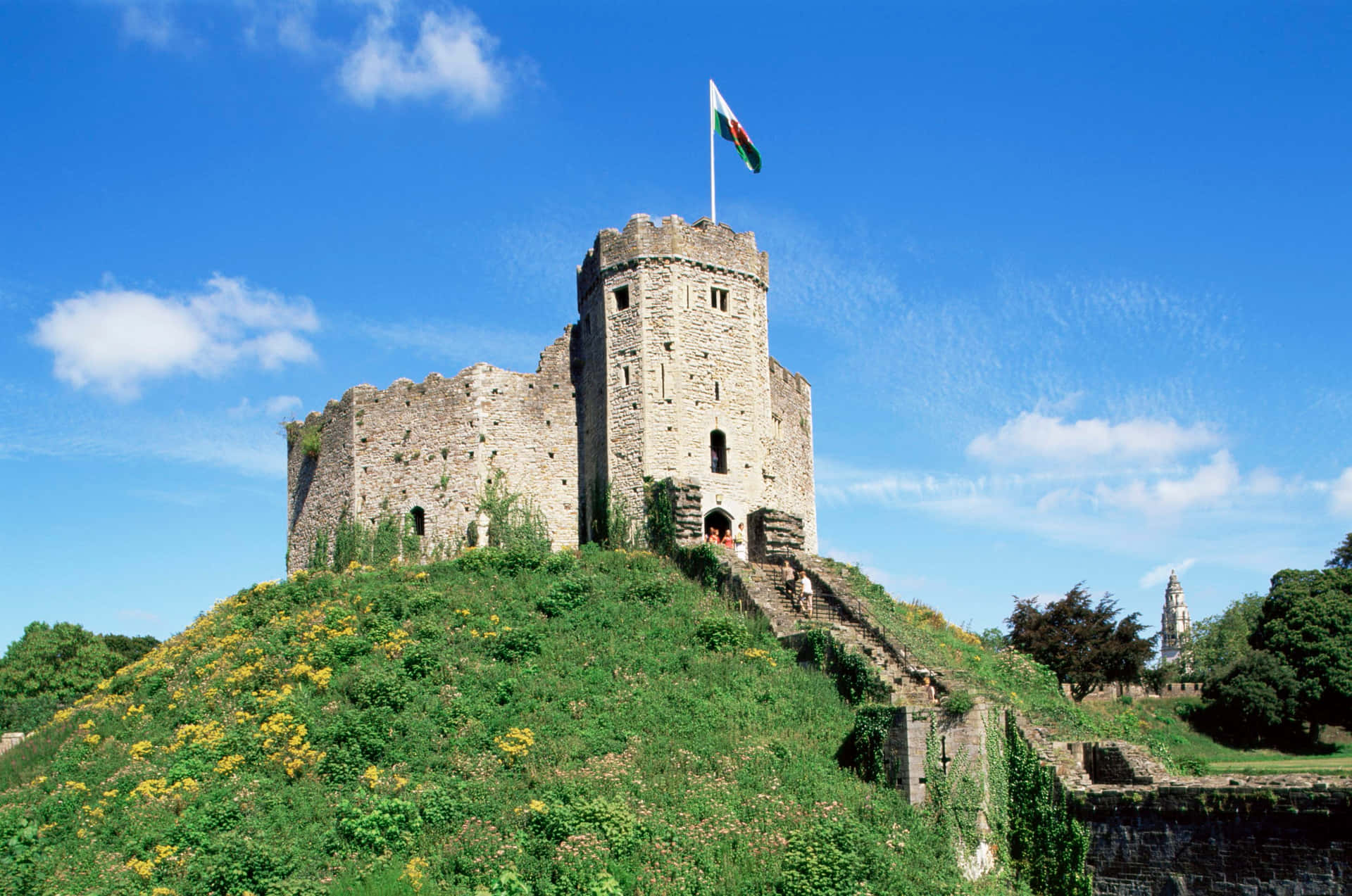 Scenic View of Cardiff Castle Surrounded by Lush Green Grass Wallpaper