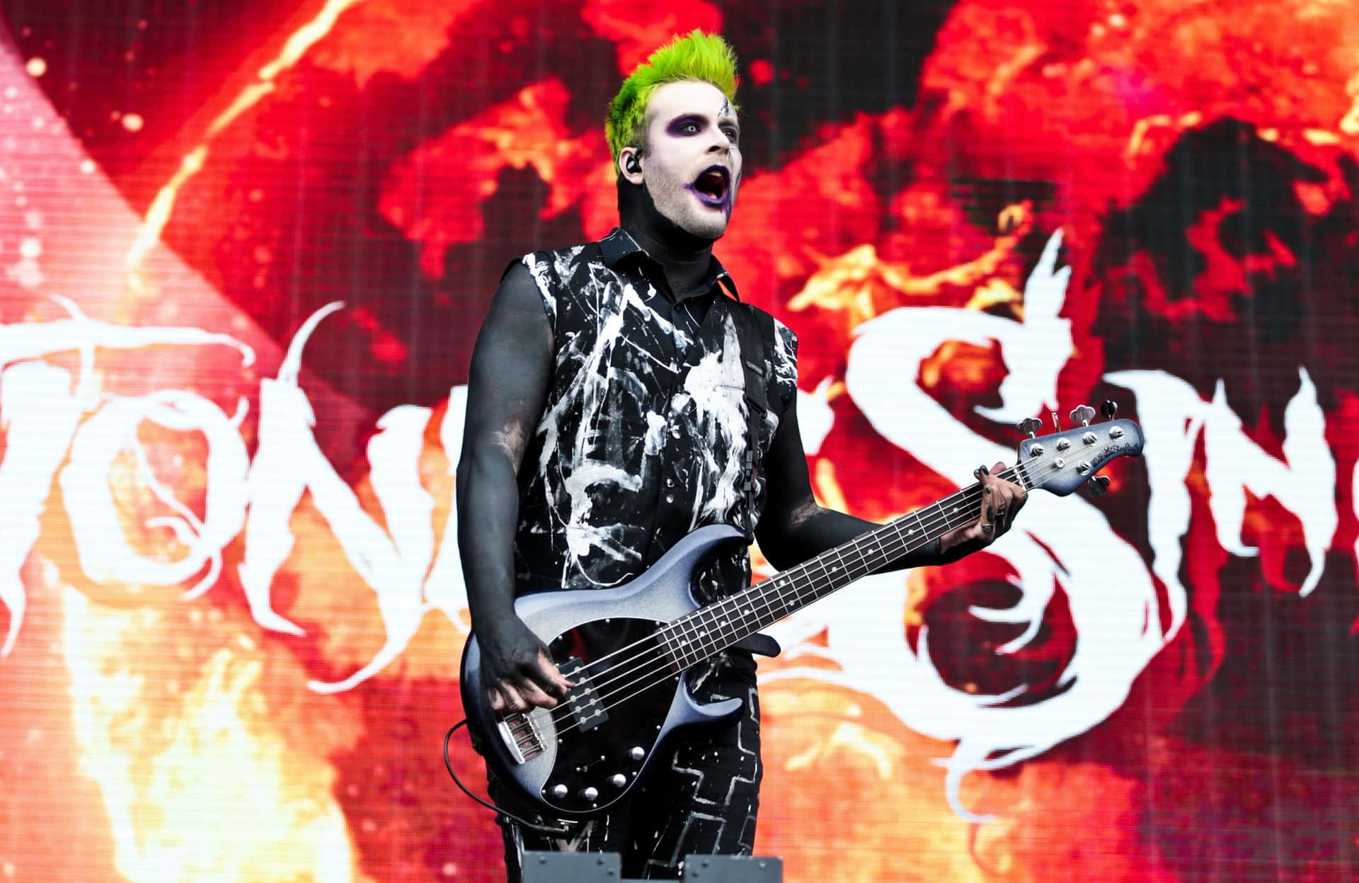 Green Haired Bassist On Stage.jpg Wallpaper