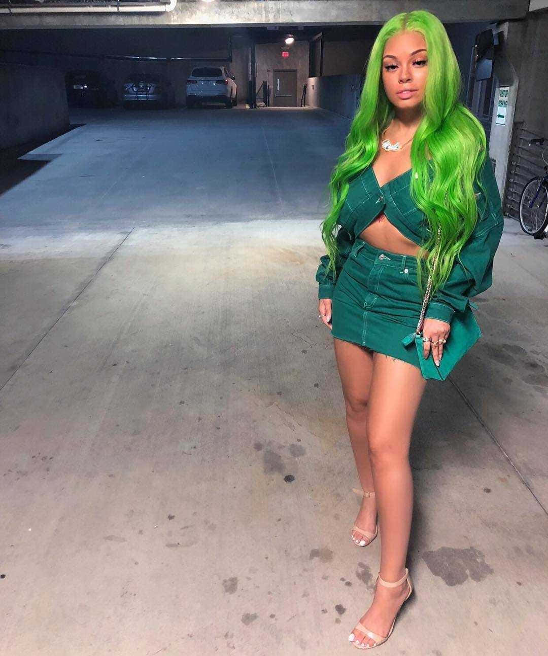 Green Haired Womanin Parking Garage Wallpaper