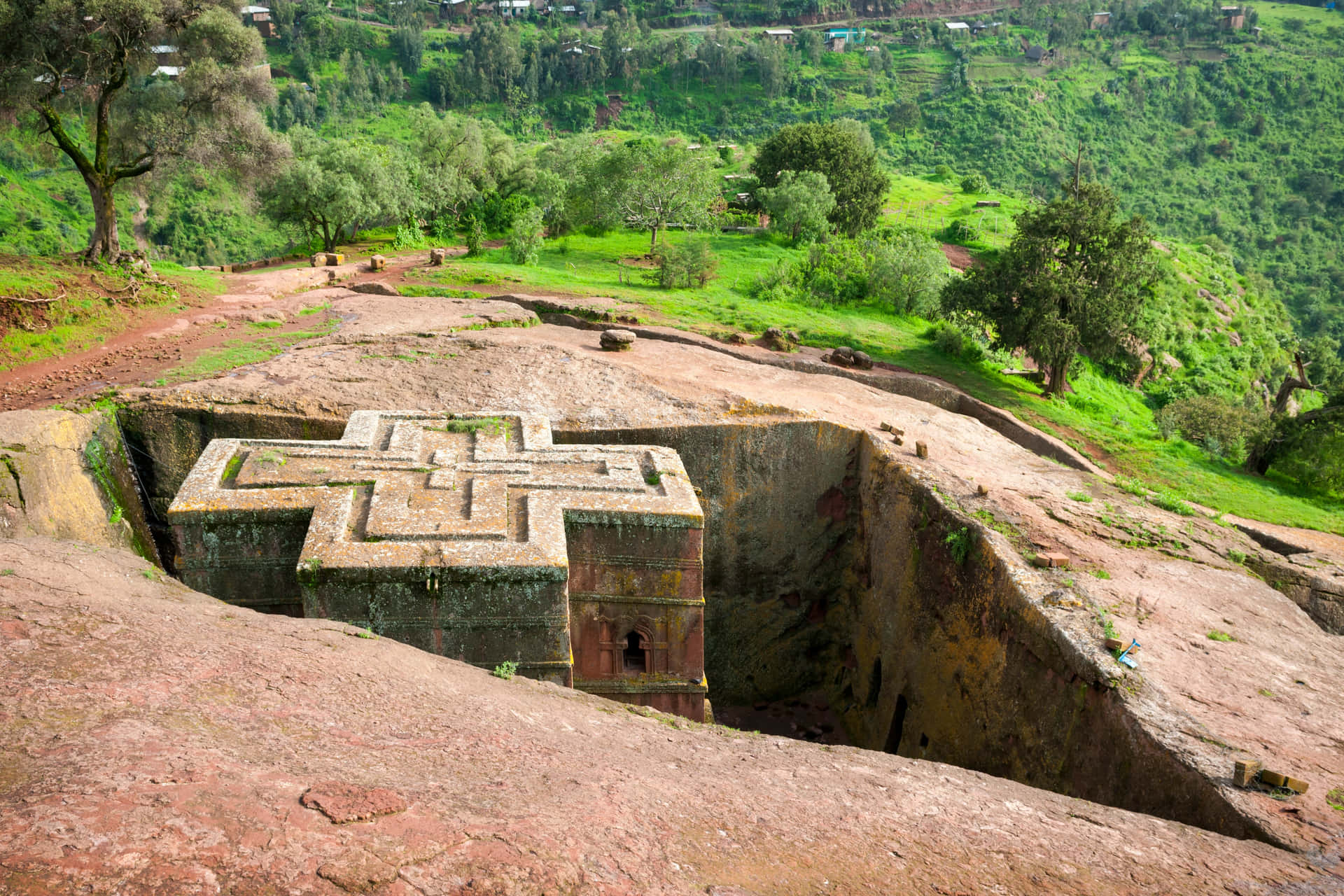 Green Hills And Trees Beside Lalibela's St. George Church Wallpaper