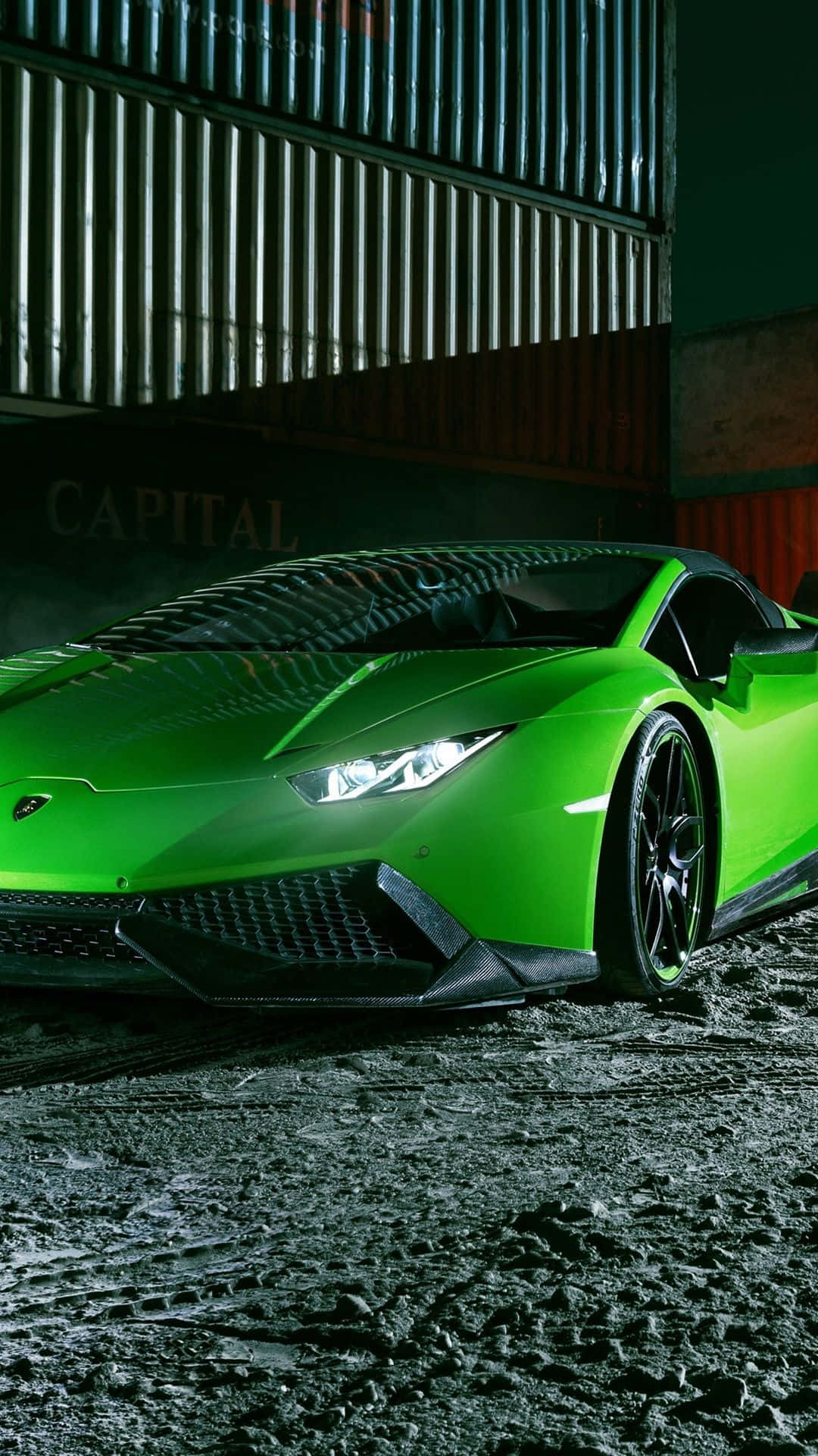 Experience the class and speed of a green Lamborghini Wallpaper