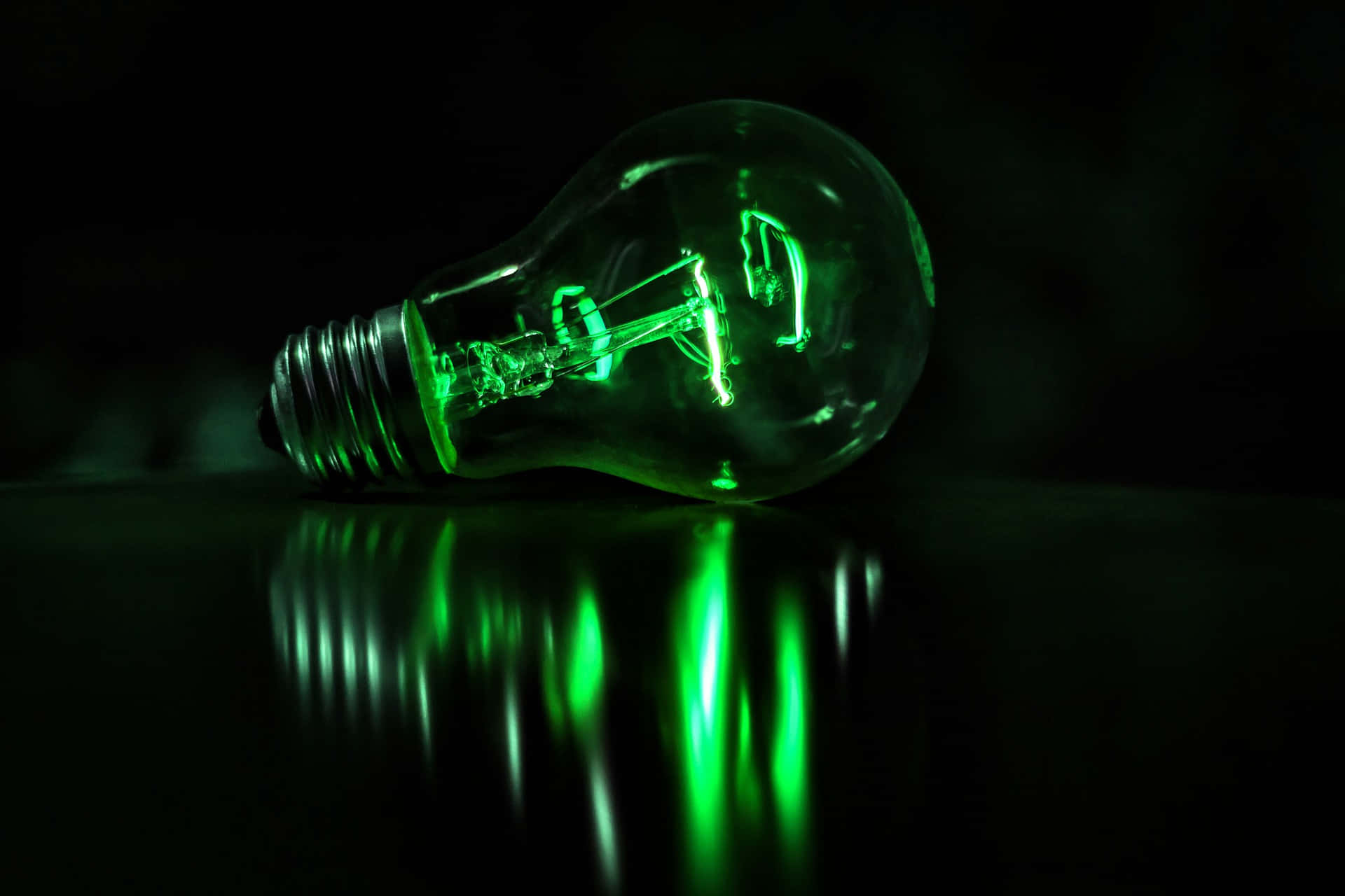 Green Led Light Bulb Dark Background Wallpaper