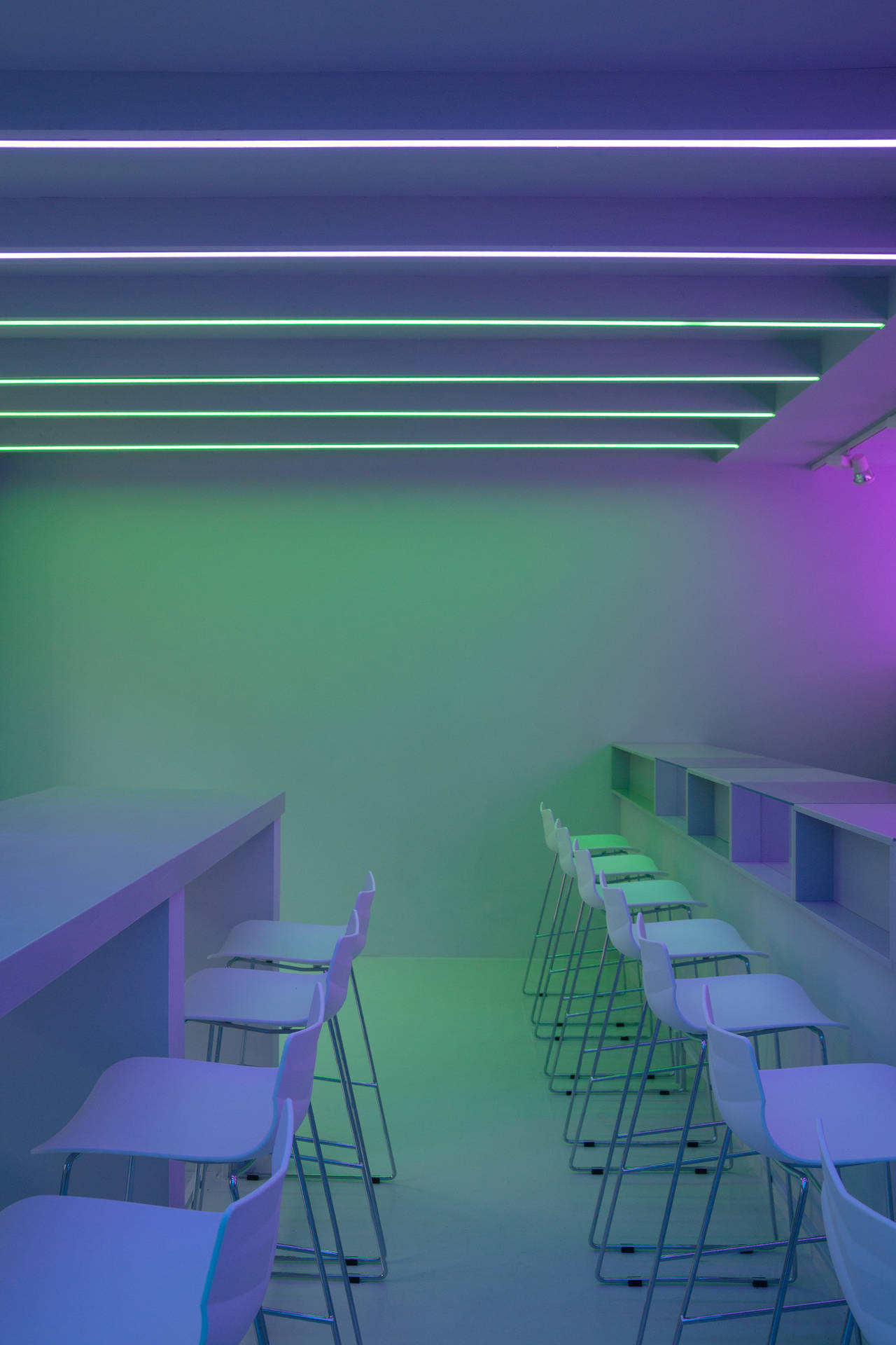 Green Minimalist Wall With Purple Lights Background