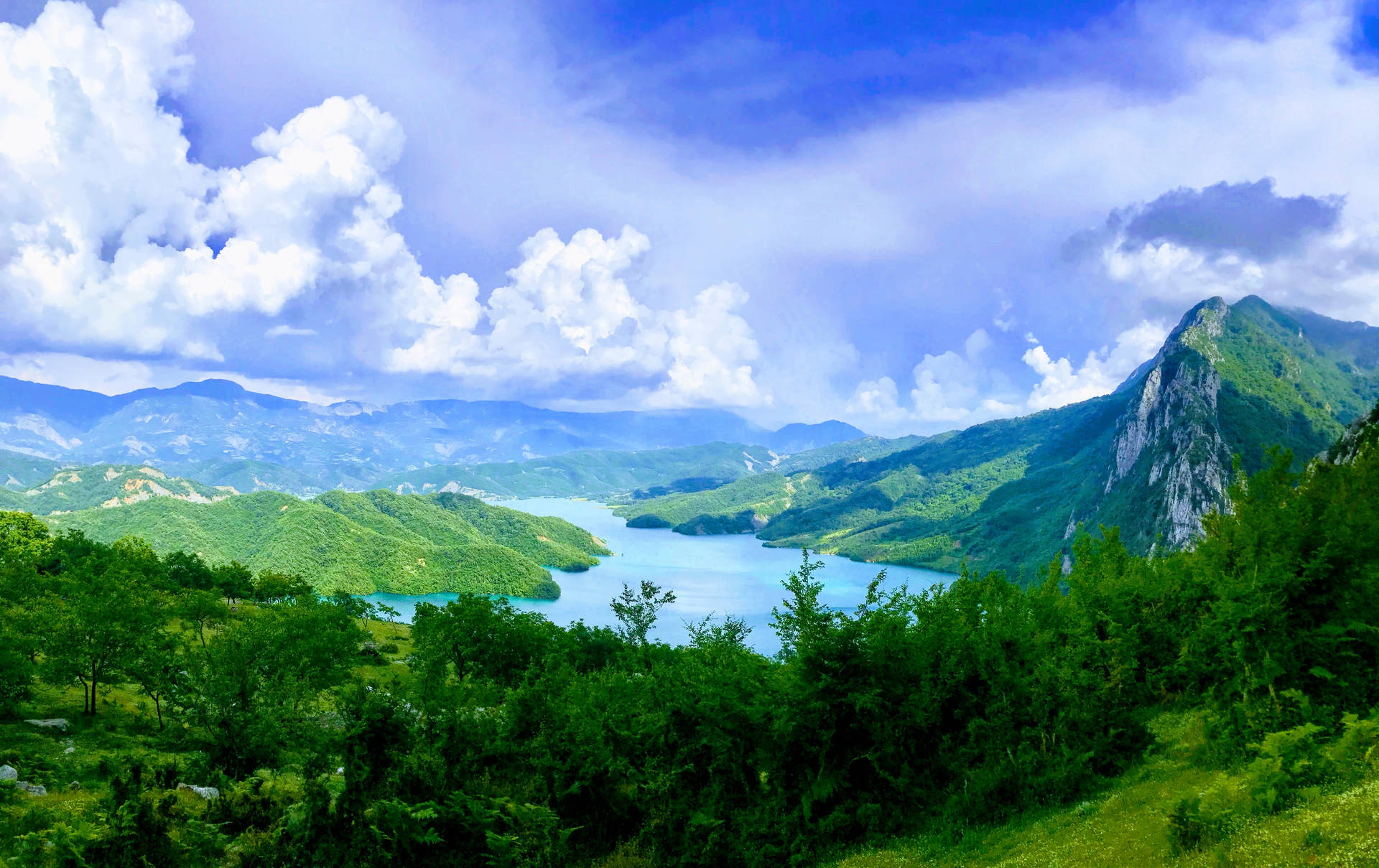Green Mountains And Azure Lake Wallpaper