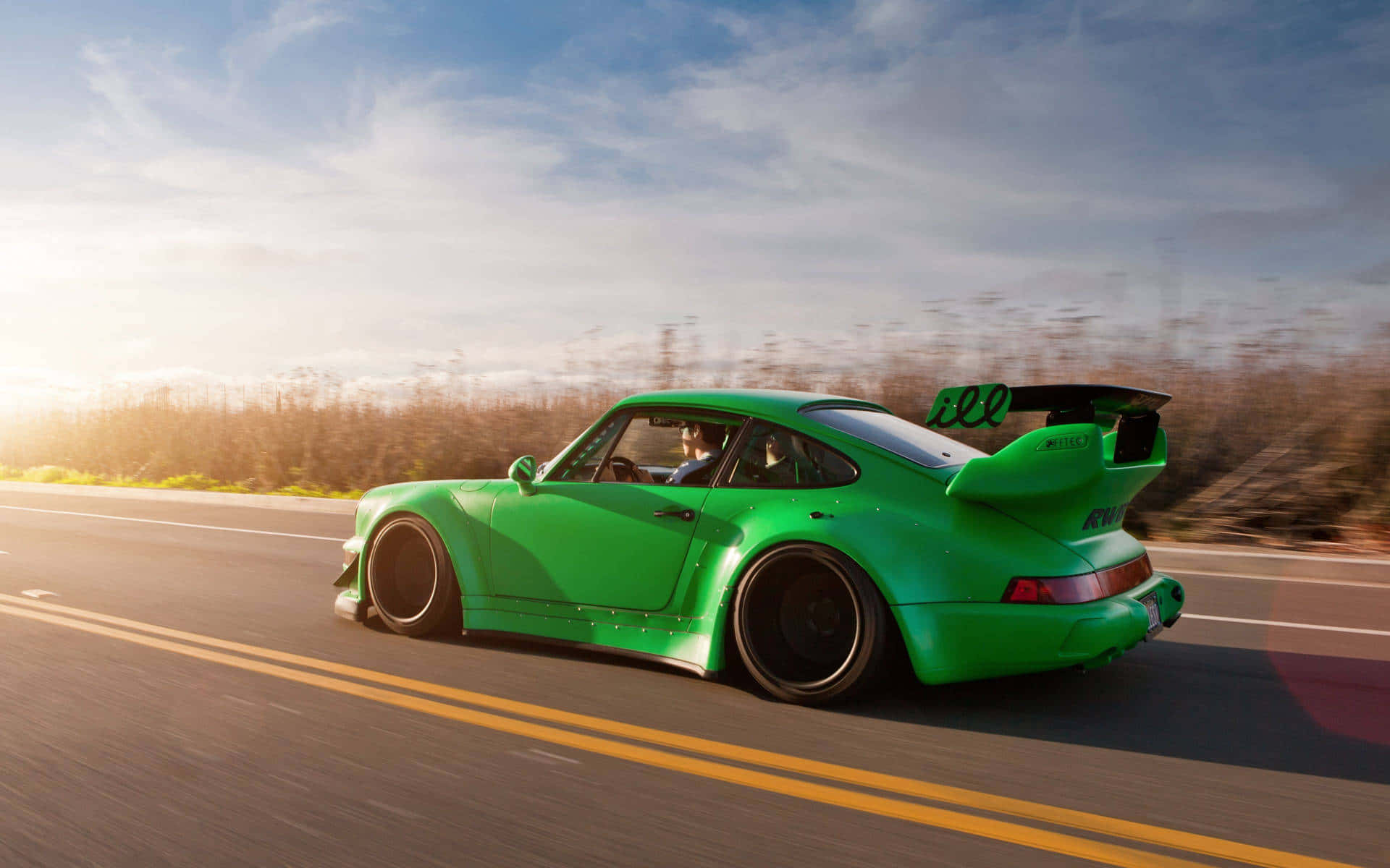 Green R W B Porsche Speedingon Highway Wallpaper