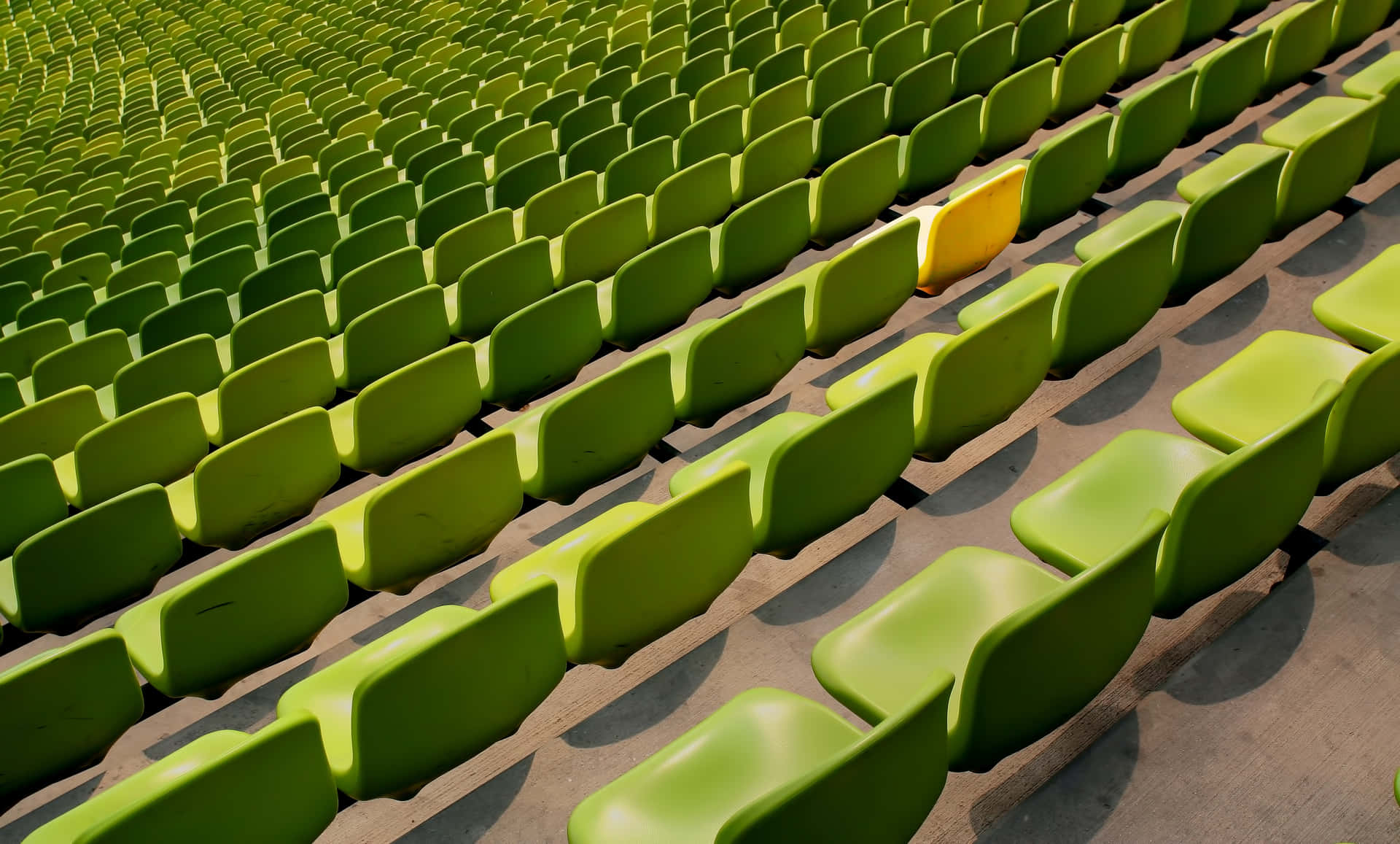 Green Seats With A Yellow Conspicuous Chair Wallpaper