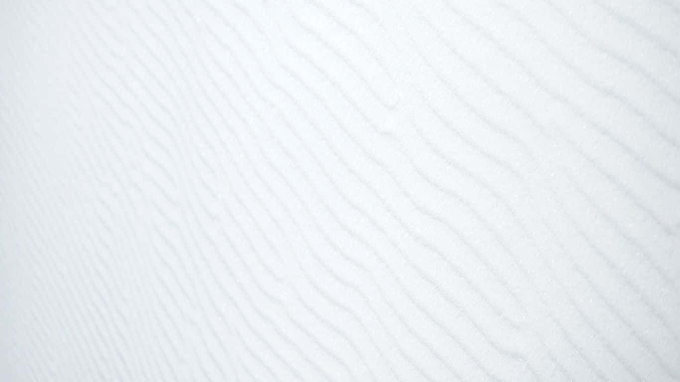 Eineweiße Wand Mit Einem Wellenmuster Wallpaper